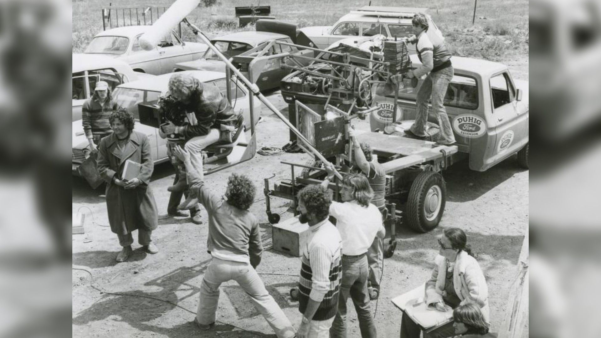 Photo of the "Mad Max" crew on the filming location. Director George Miller can be seen on the left in a coat