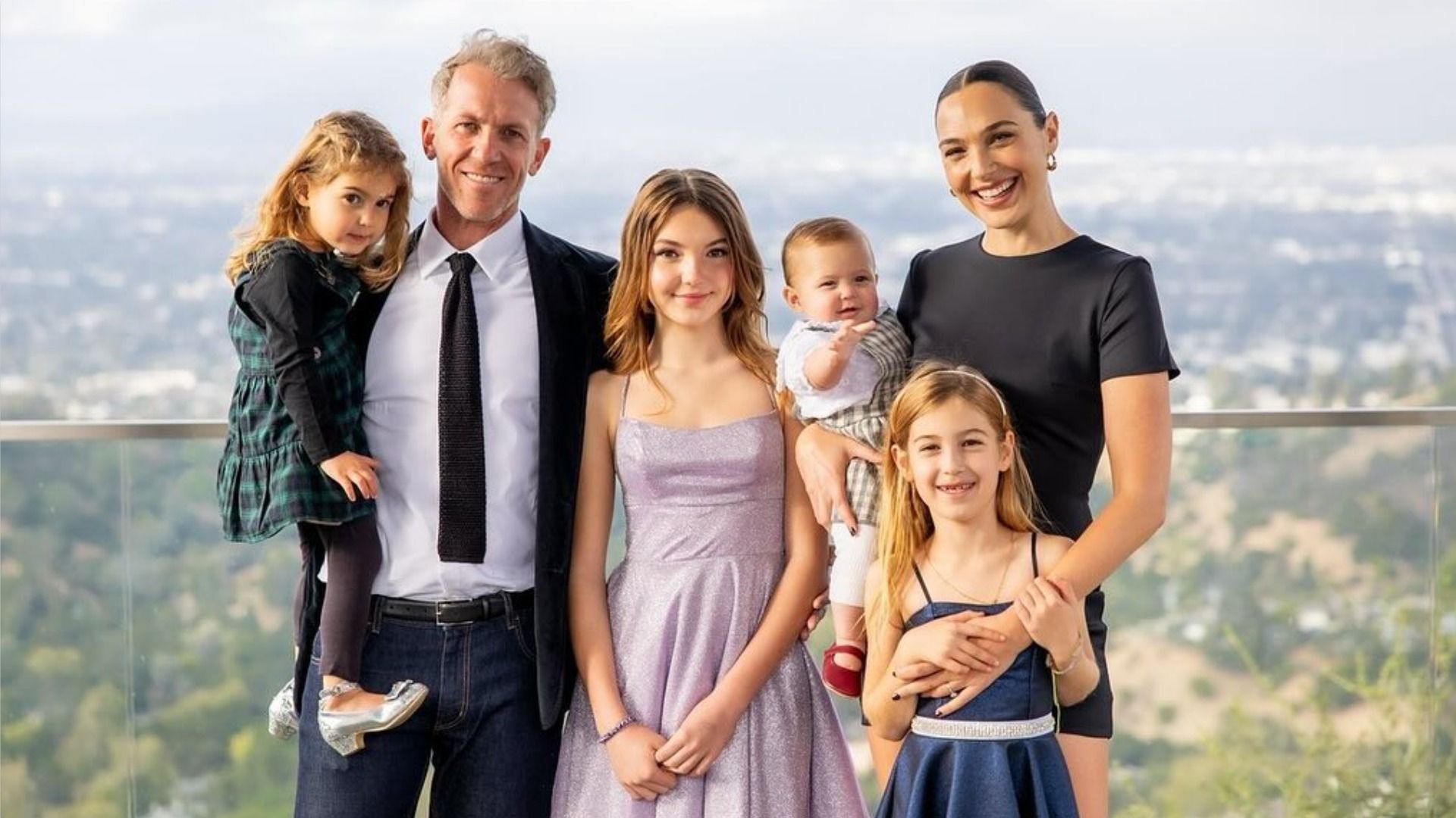 Actress Gal Gadot poses for a family photo with her husband and four daughters