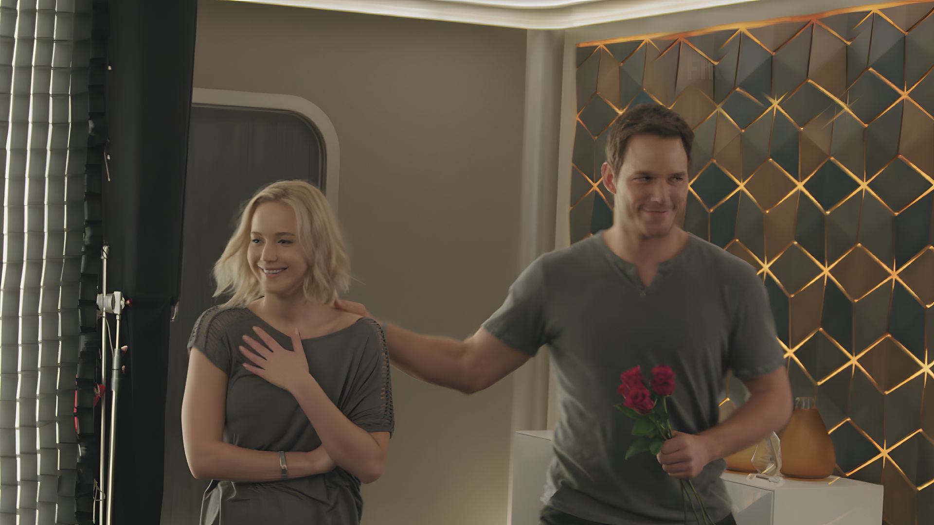 Jennifer Lawrence and Chris Pratt in motion, both seem embarrassed