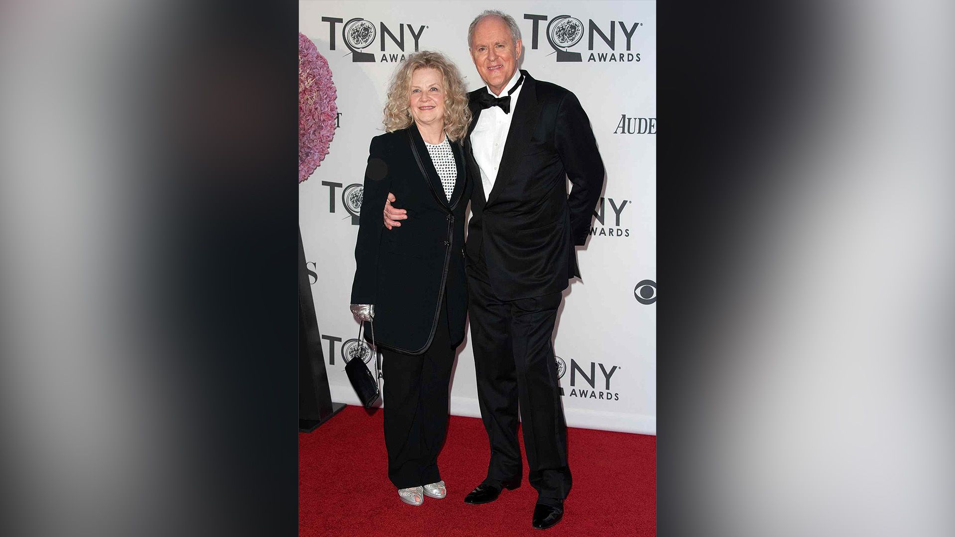 John Lithgow and Mary Yeager in black suits at the Tony Awards