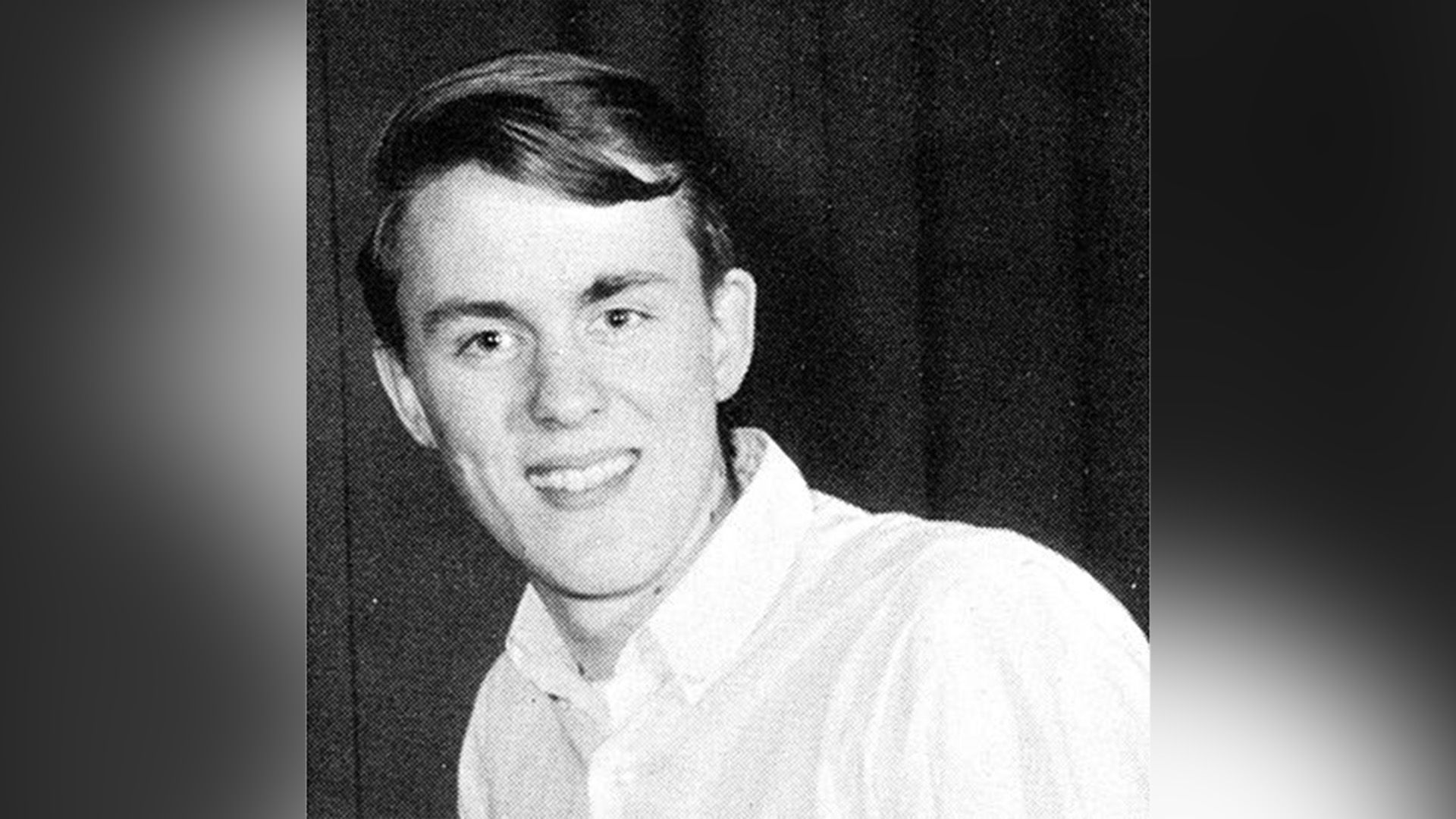 Young John Lithgow in a white shirt