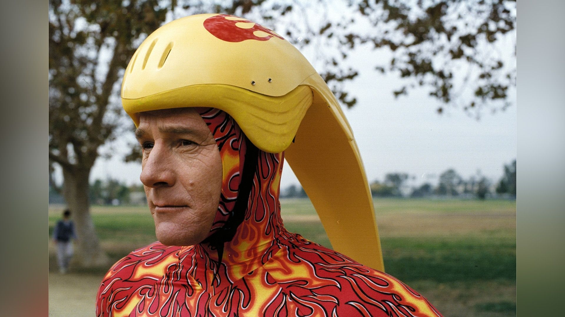 Bryan Cranston in a yellow bicycle helmet in a scene from 'Malcolm in the Middle'