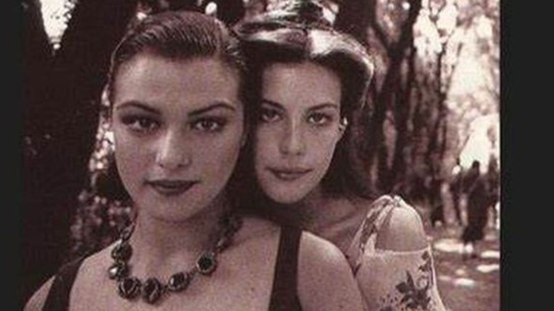 A joint photo of Rachel Weisz and Liv Tyler with a sepia filter