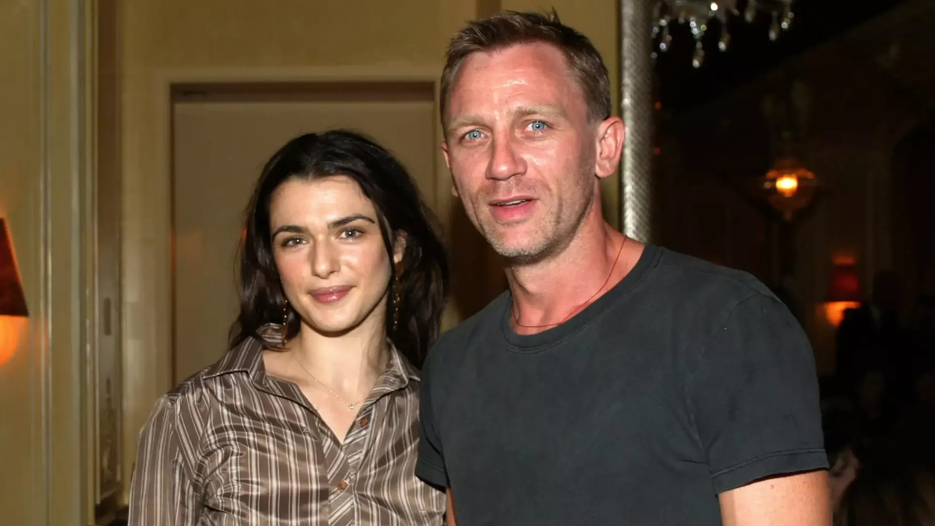 Rachel Weisz and Daniel Craig pose together in front of the camera