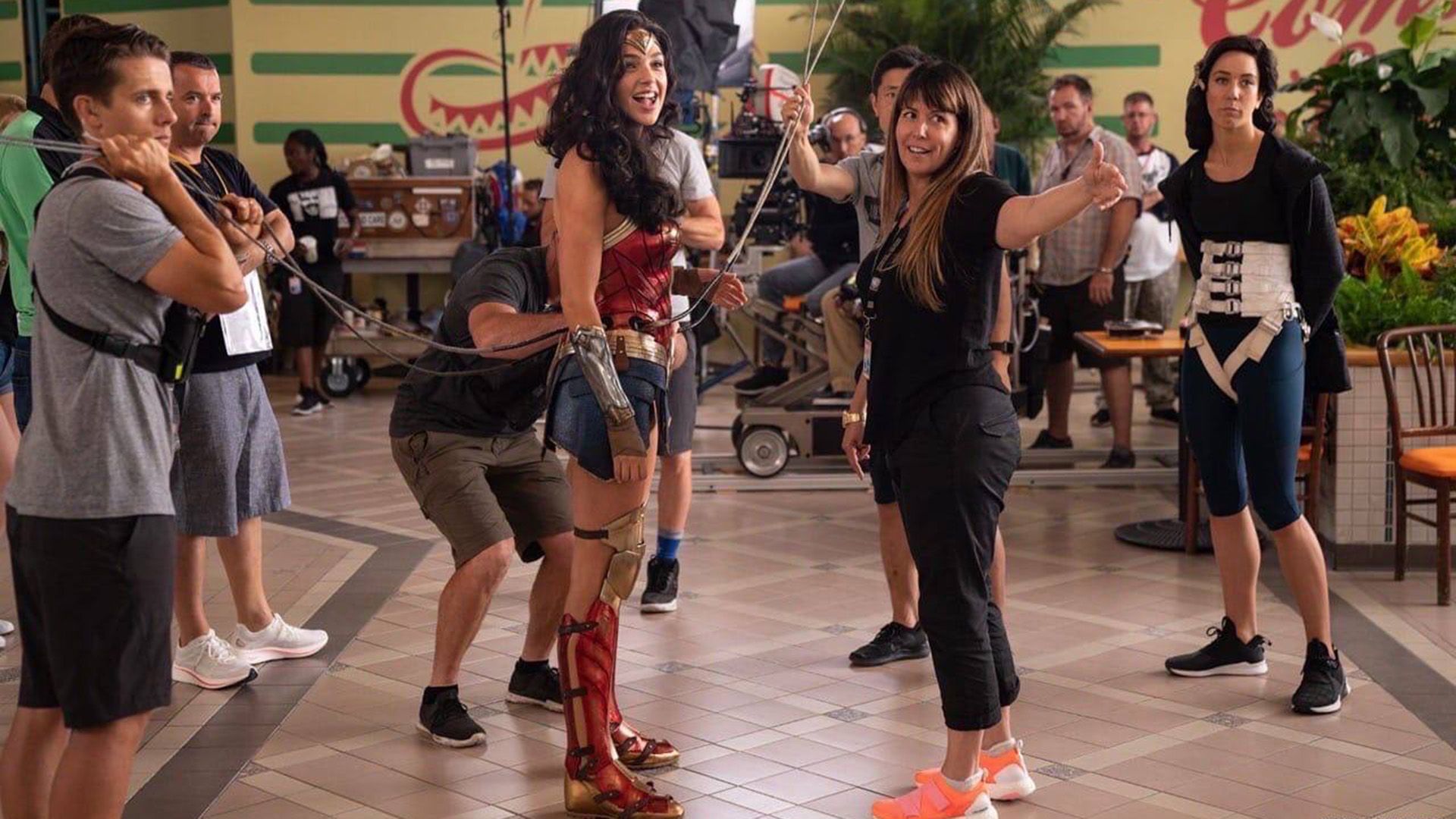 Gal Gadot as Wonder Woman surrounded by the film crew