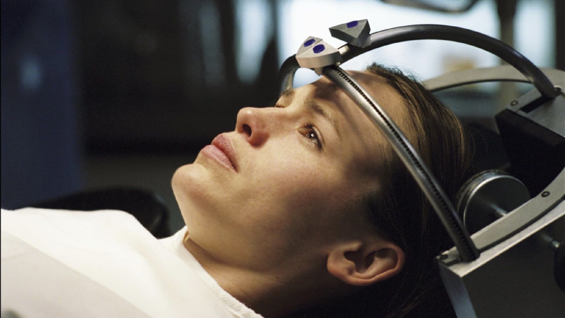 Jennifer Garner looks up while lying in a futuristic chair