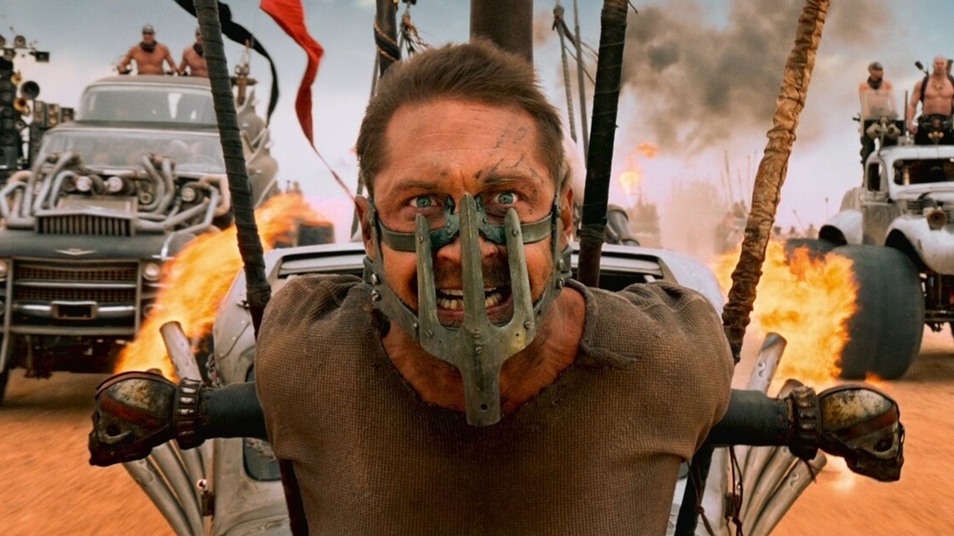 Tom Hardy as Mad Max with an iron mask on his face
