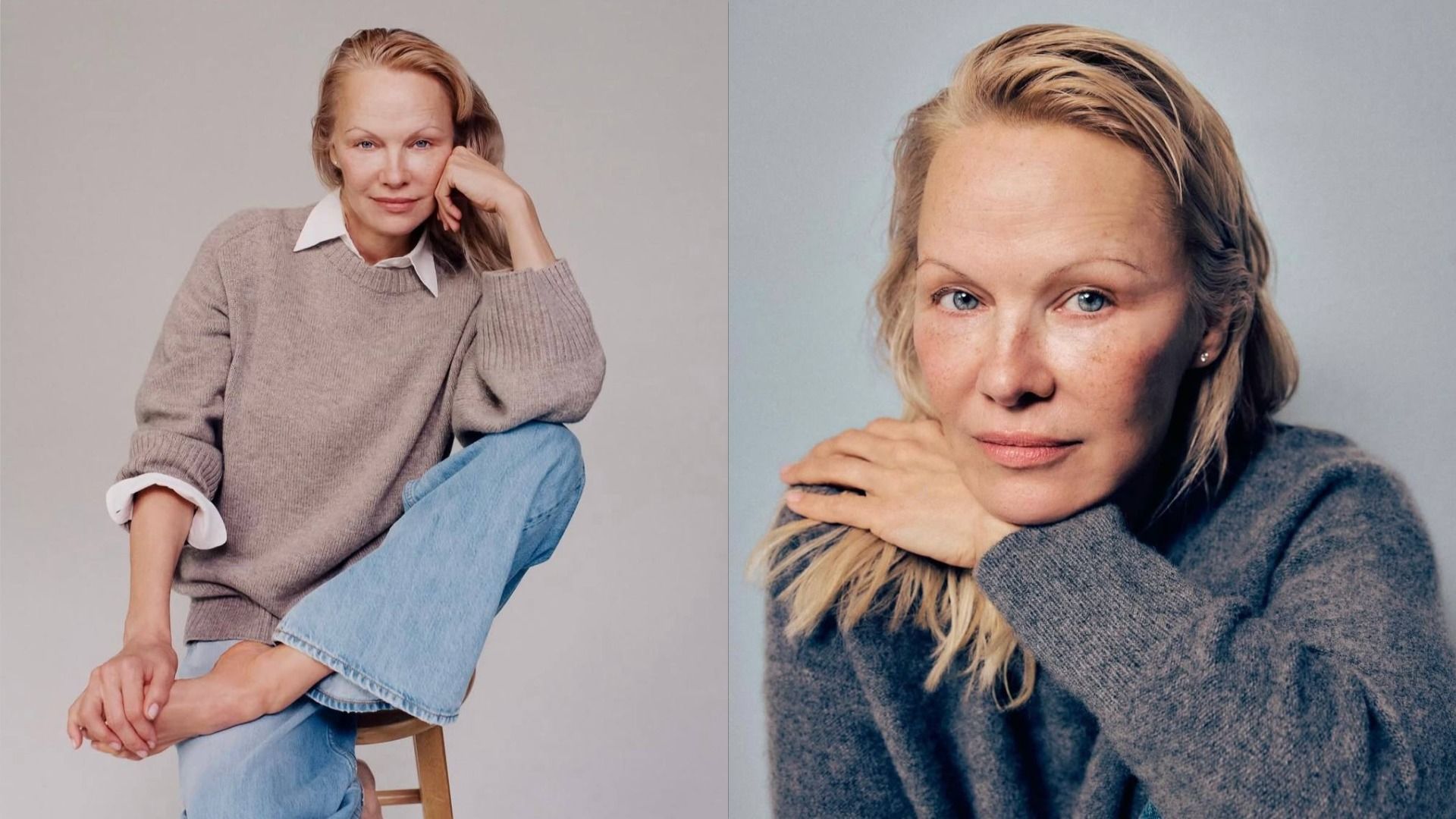 Actress Pamela Anderson in a beige sweater and white shirt sits on a chair, holding her leg with her hand and looking at the camera