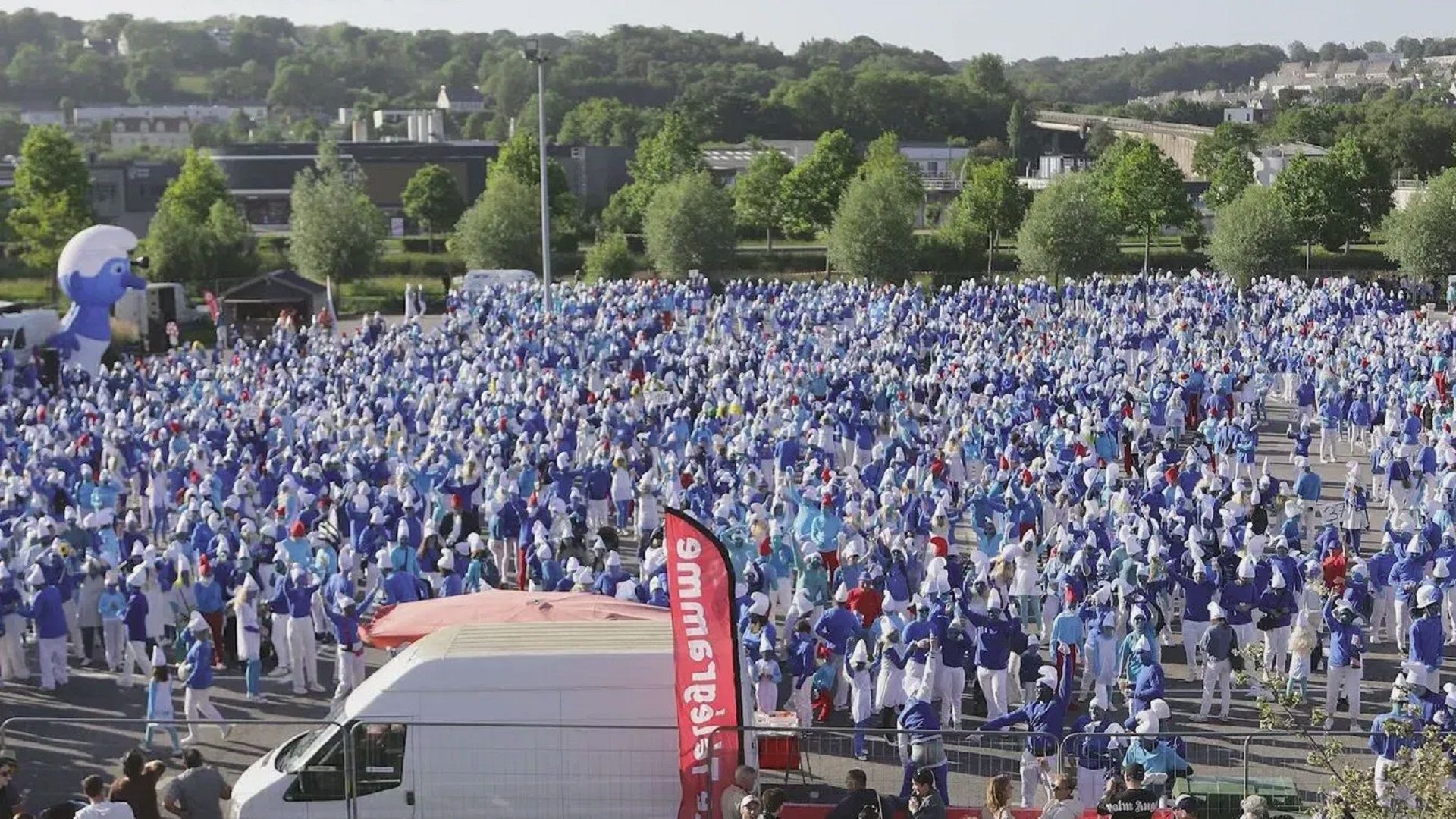 A square filled with people with blue faces