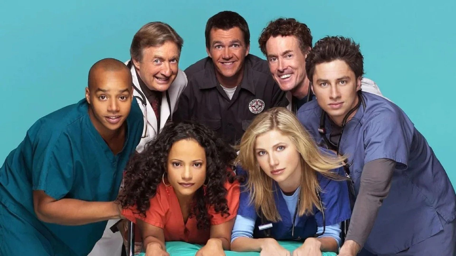 Actors of the series "Scrubs" as doctors looking into the camera