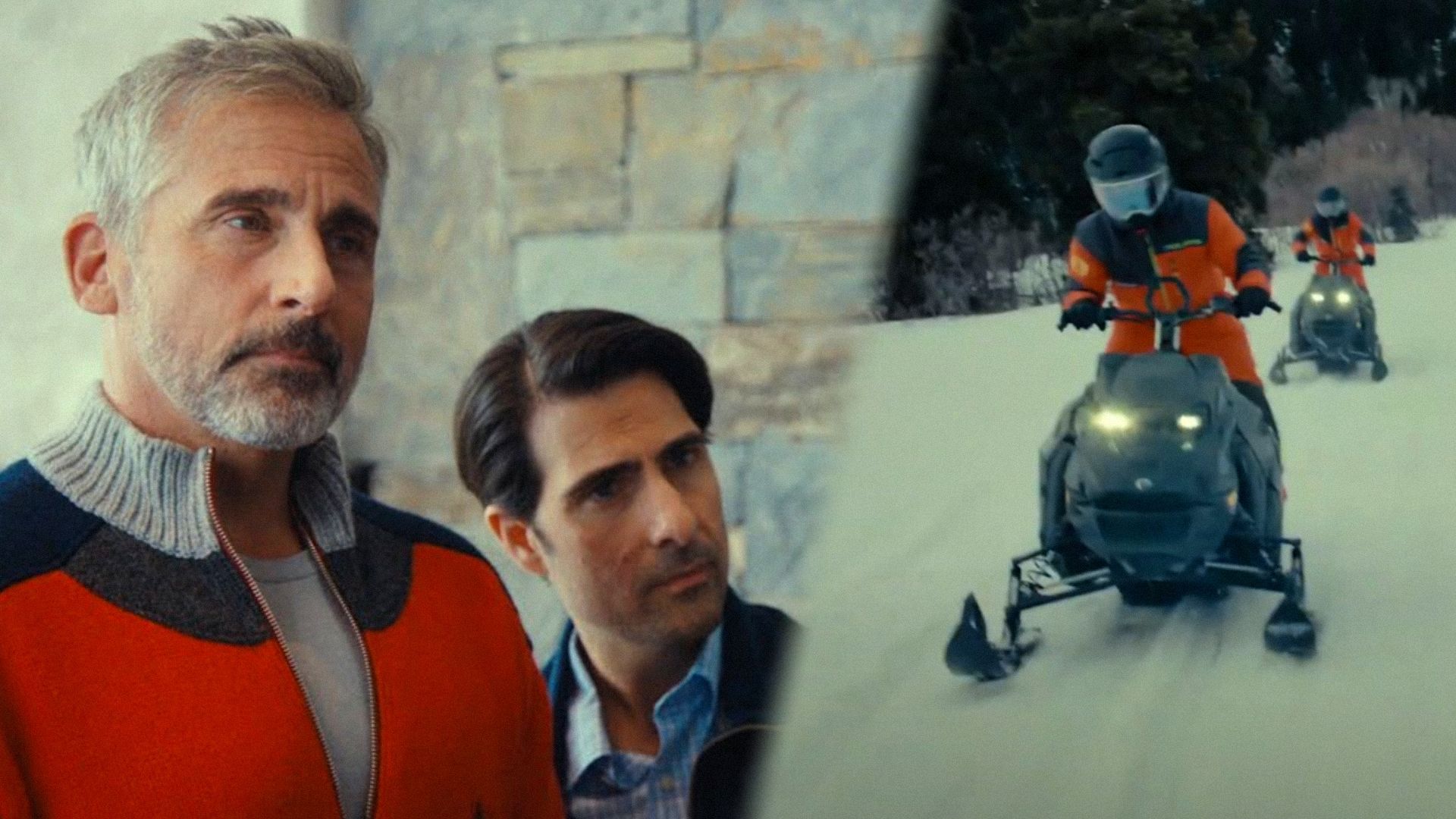 Actor Steve Carell in an orange sweater looks to the side against a stone wall background