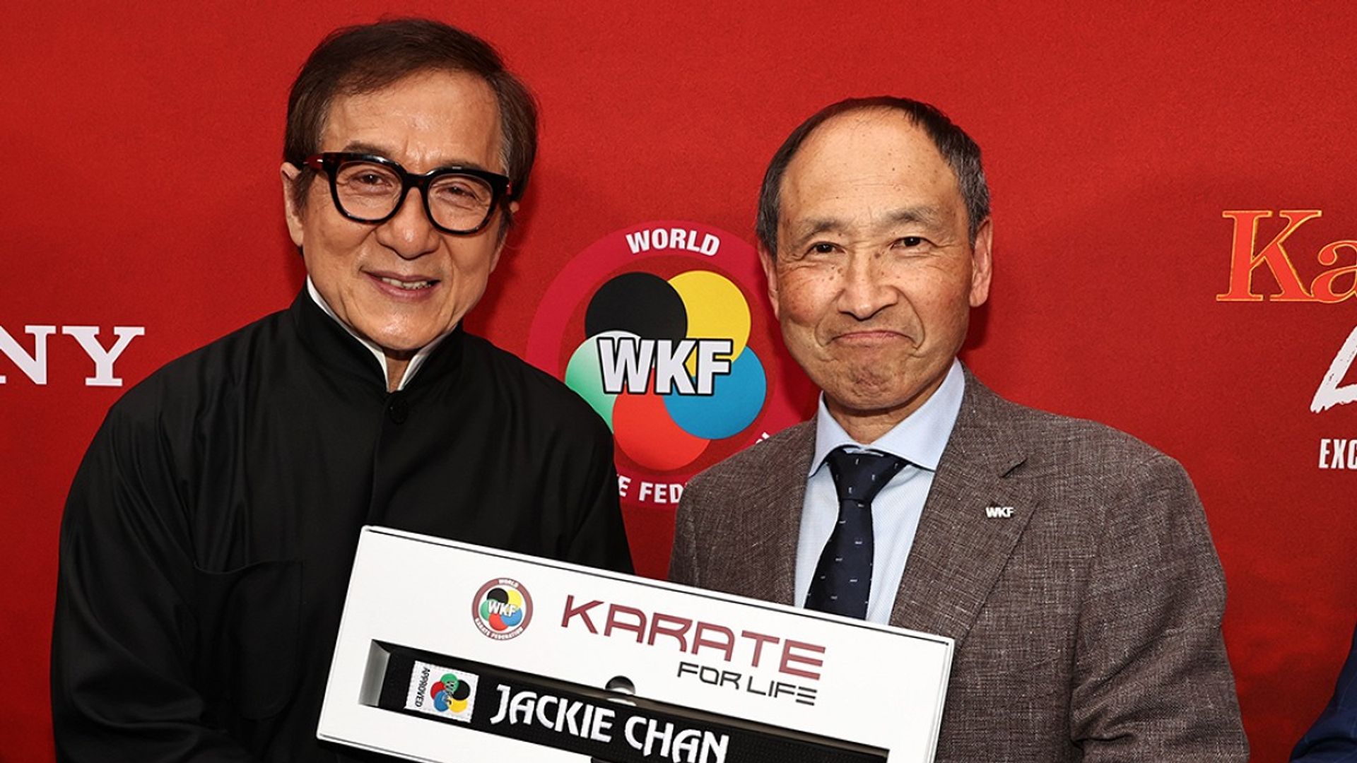 Jackie Chan receives a black belt in karate