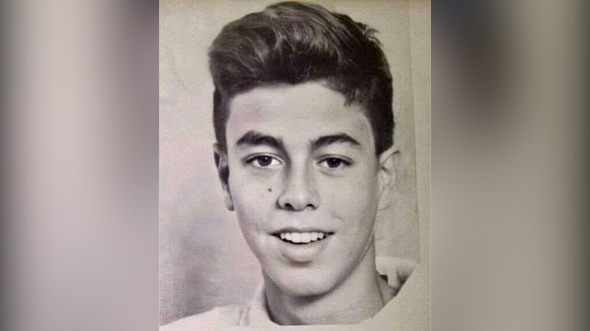 School portrait of a smiling Enrique Iglesias