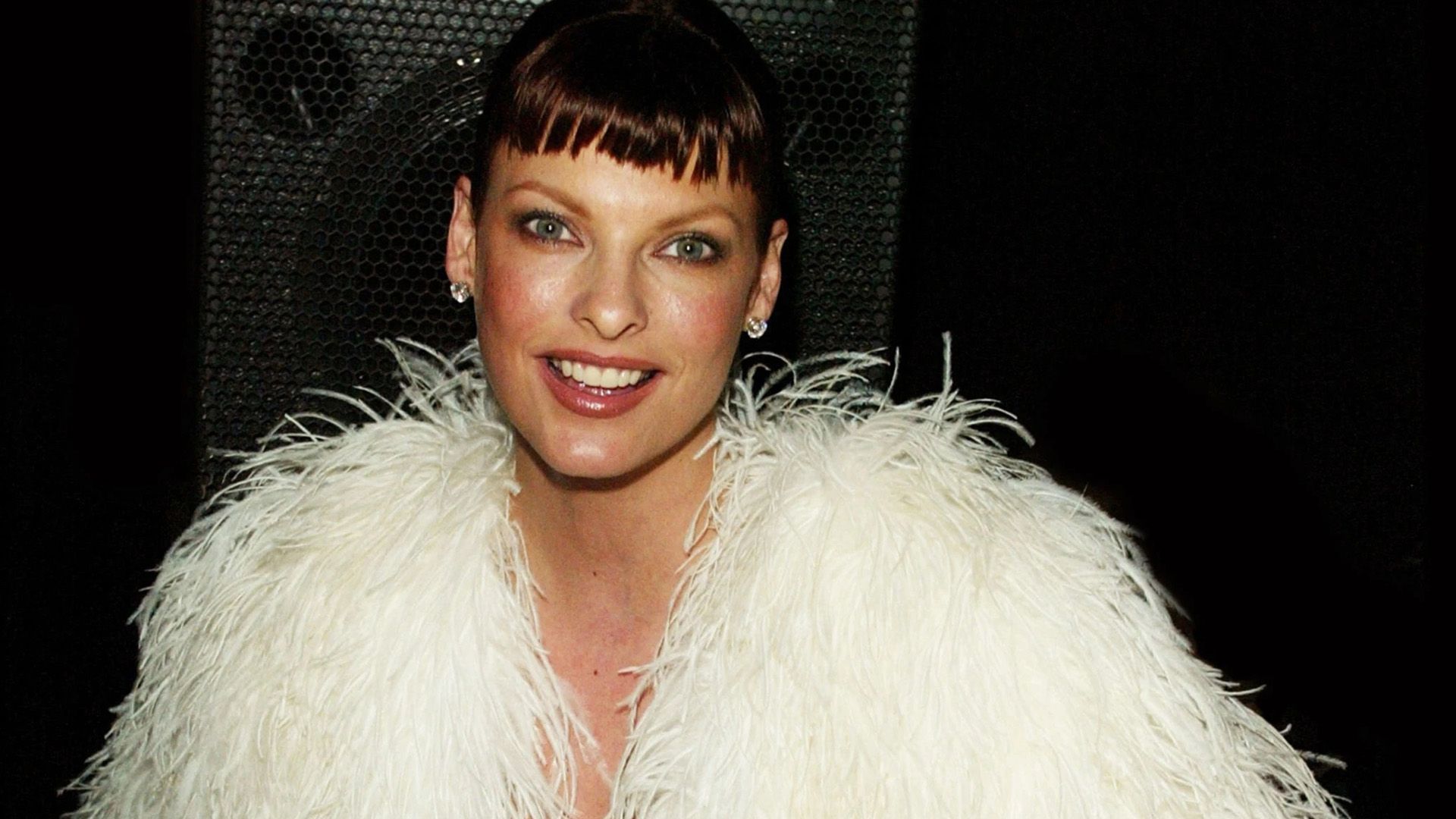 Supermodel Linda Evangelista in an outfit made of white feathers