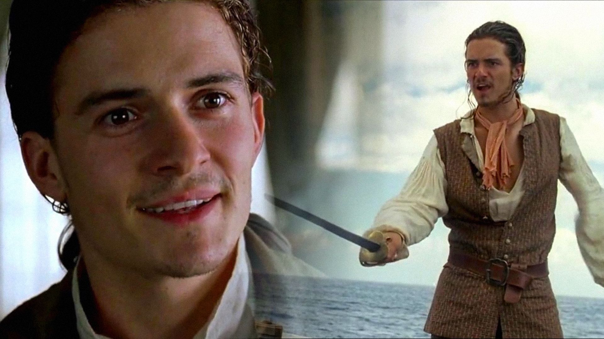 Actor Orlando Bloom as a pirate stands with sword in hand