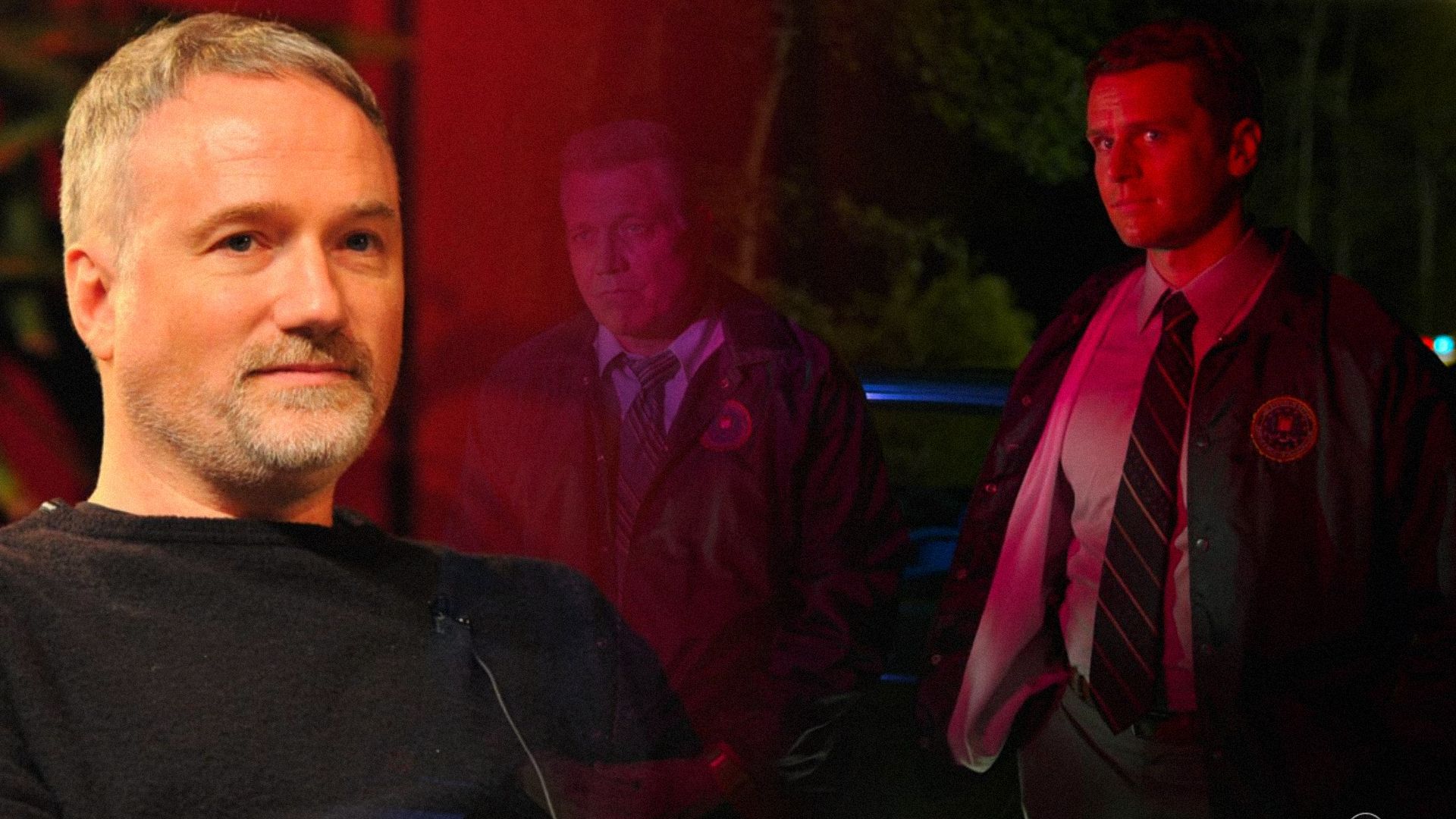 Director David Fincher in a black jacket and two men in police uniforms