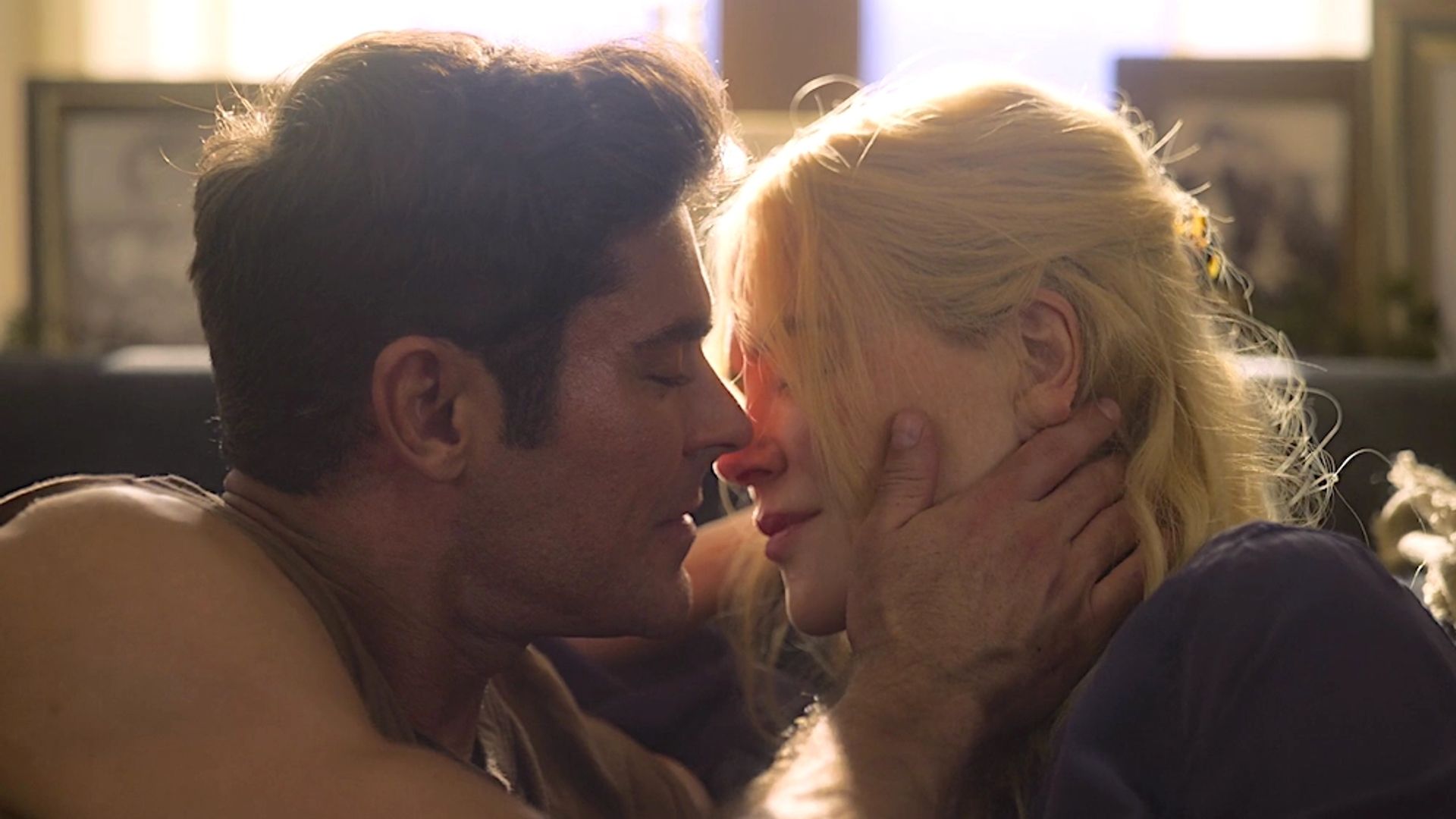 Close-up of Zac Efron and Nicole Kidman's faces, moment before a kiss
