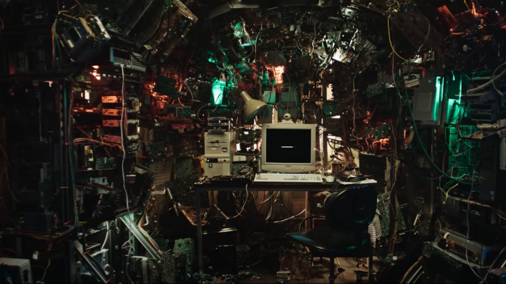 A computer in the center of the room with numerous wires extending from it
