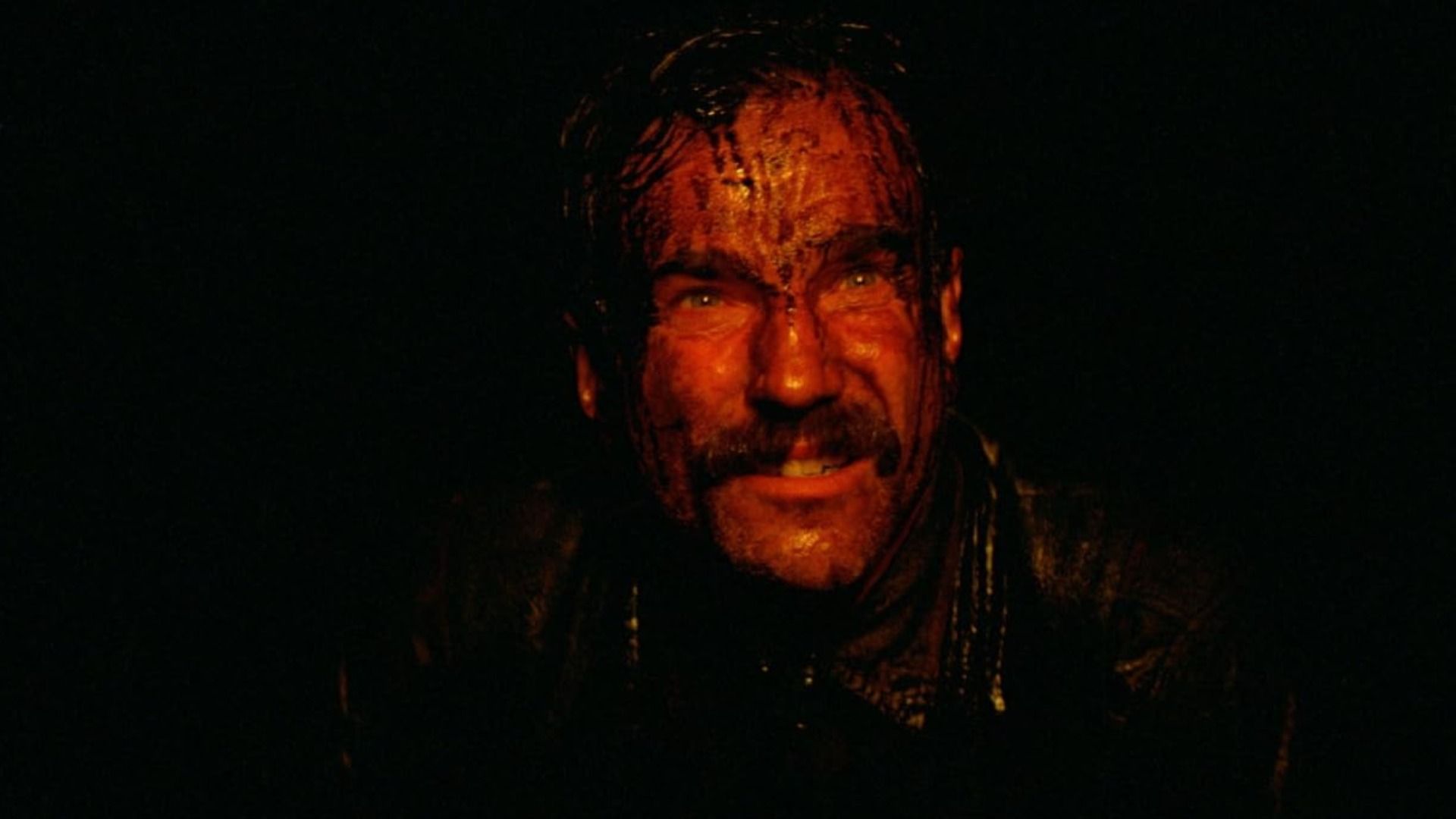 Actor Daniel Day-Lewis smiles with oil drops on his face
