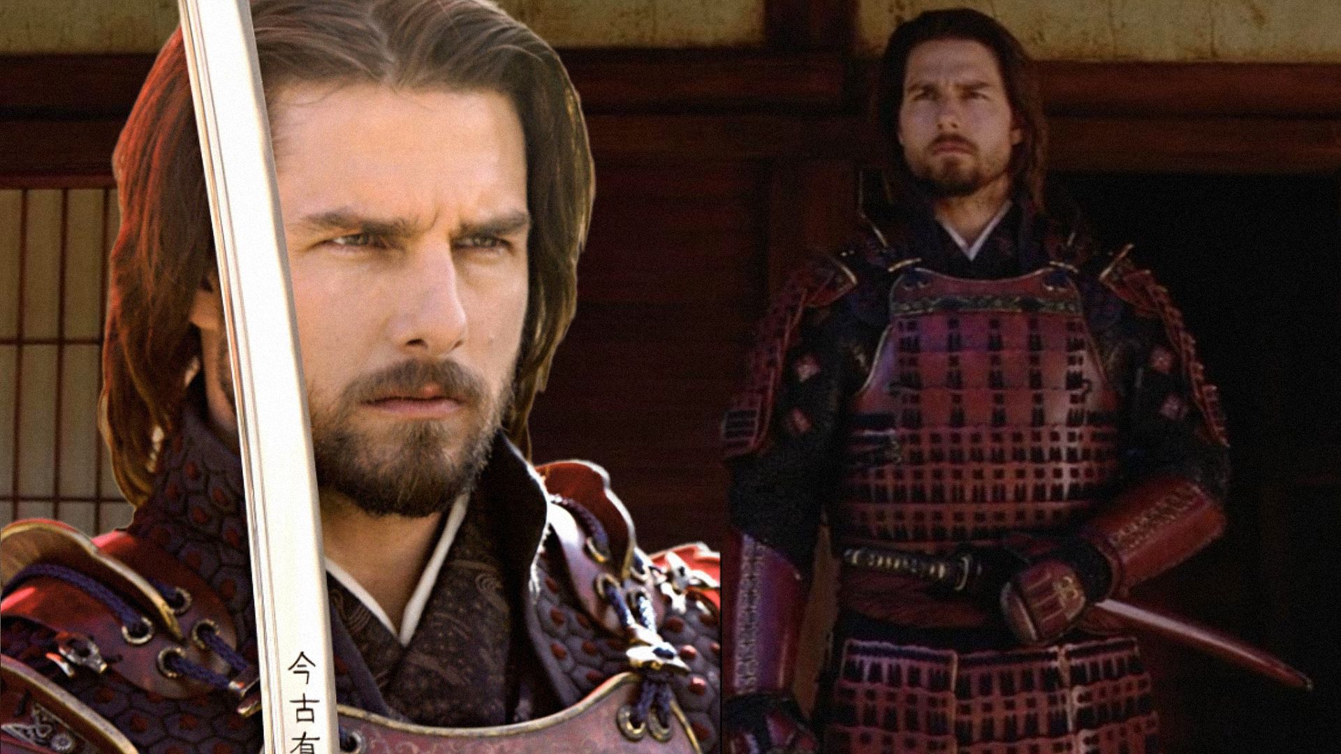 Actor Tom Cruise in red samurai armor stands holding a sword