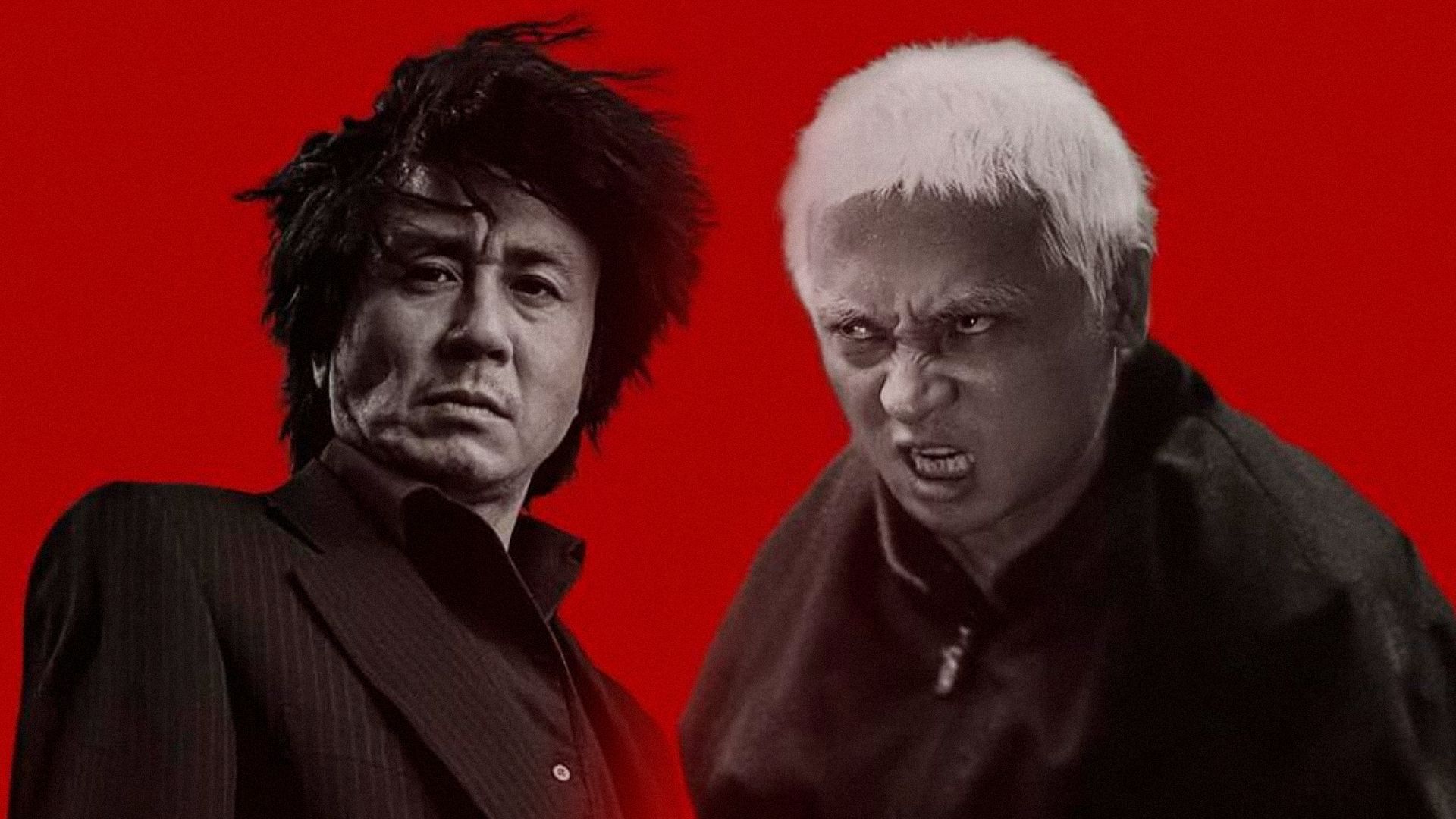 Two men in black clothing stand next to each other against a red background