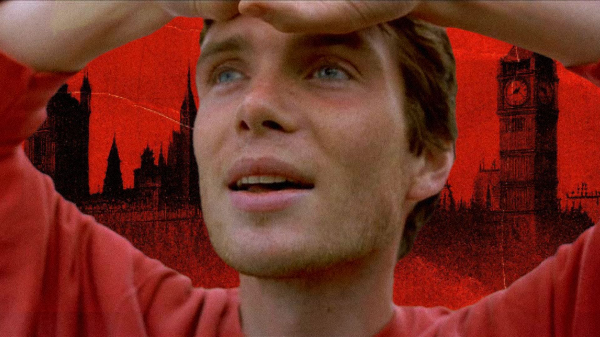 Actor Cillian Murphy raises his hands to his head and smiles against the backdrop of London's skyline in red tones