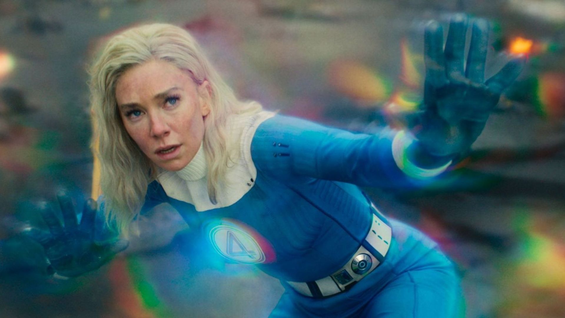 Vanessa Kirby in a Fantastic Four costume uses her superpower with rainbow energies glowing around her