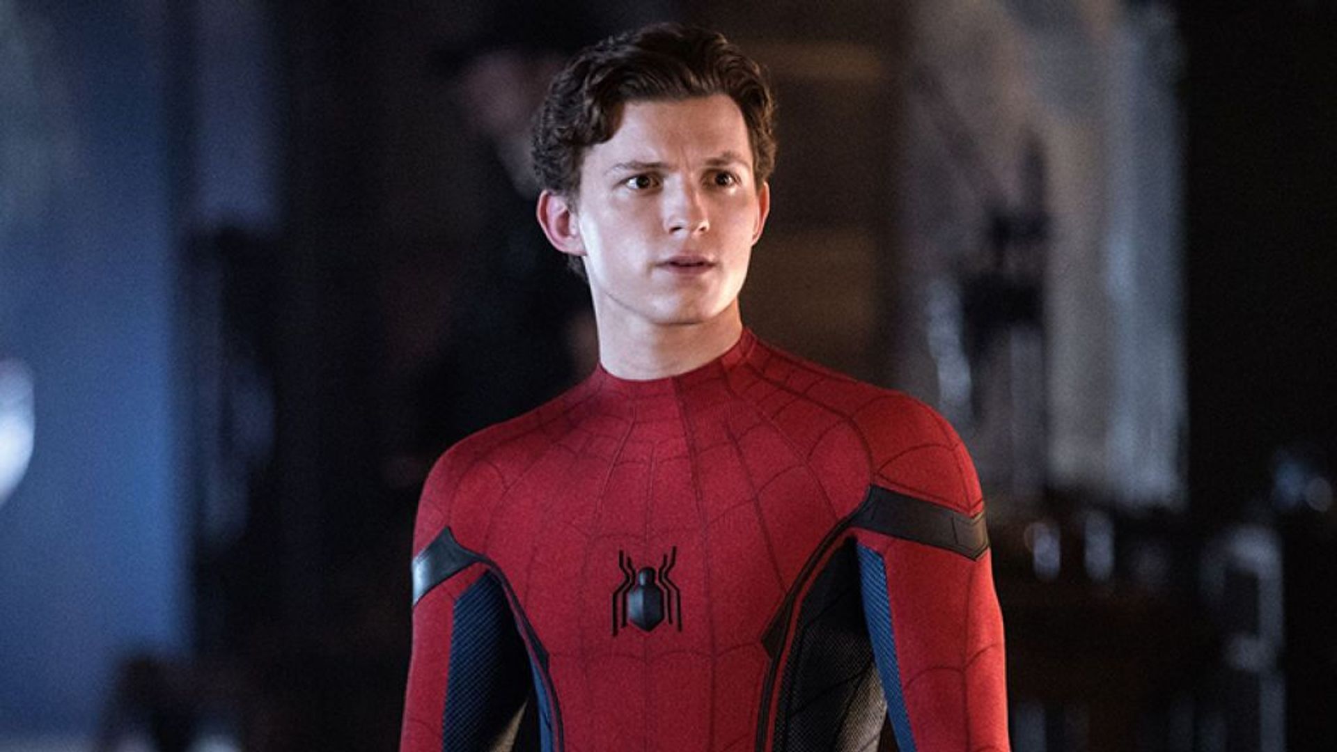 Tom Holland in Spider-Man costume with surprised expression on his face