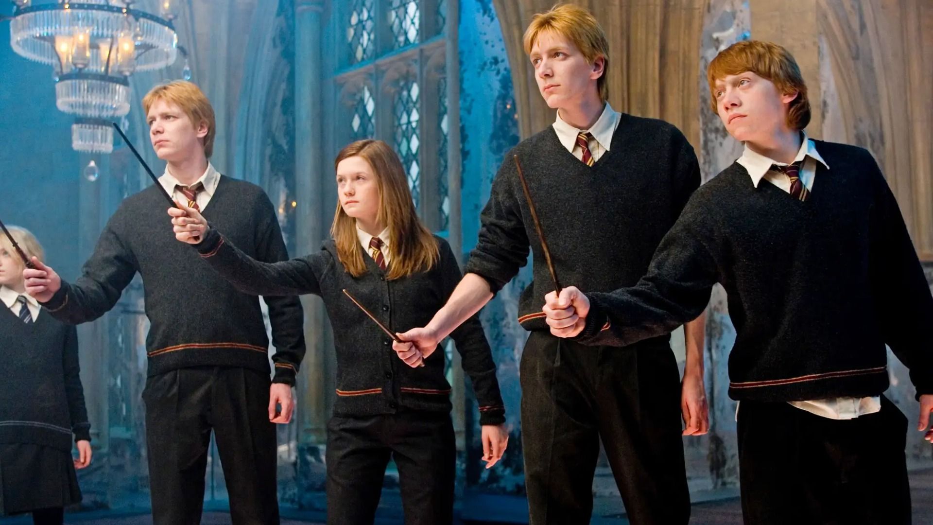 The Phelps twins, Bonnie Wright and Rupert Grint in school uniforms with magic wands