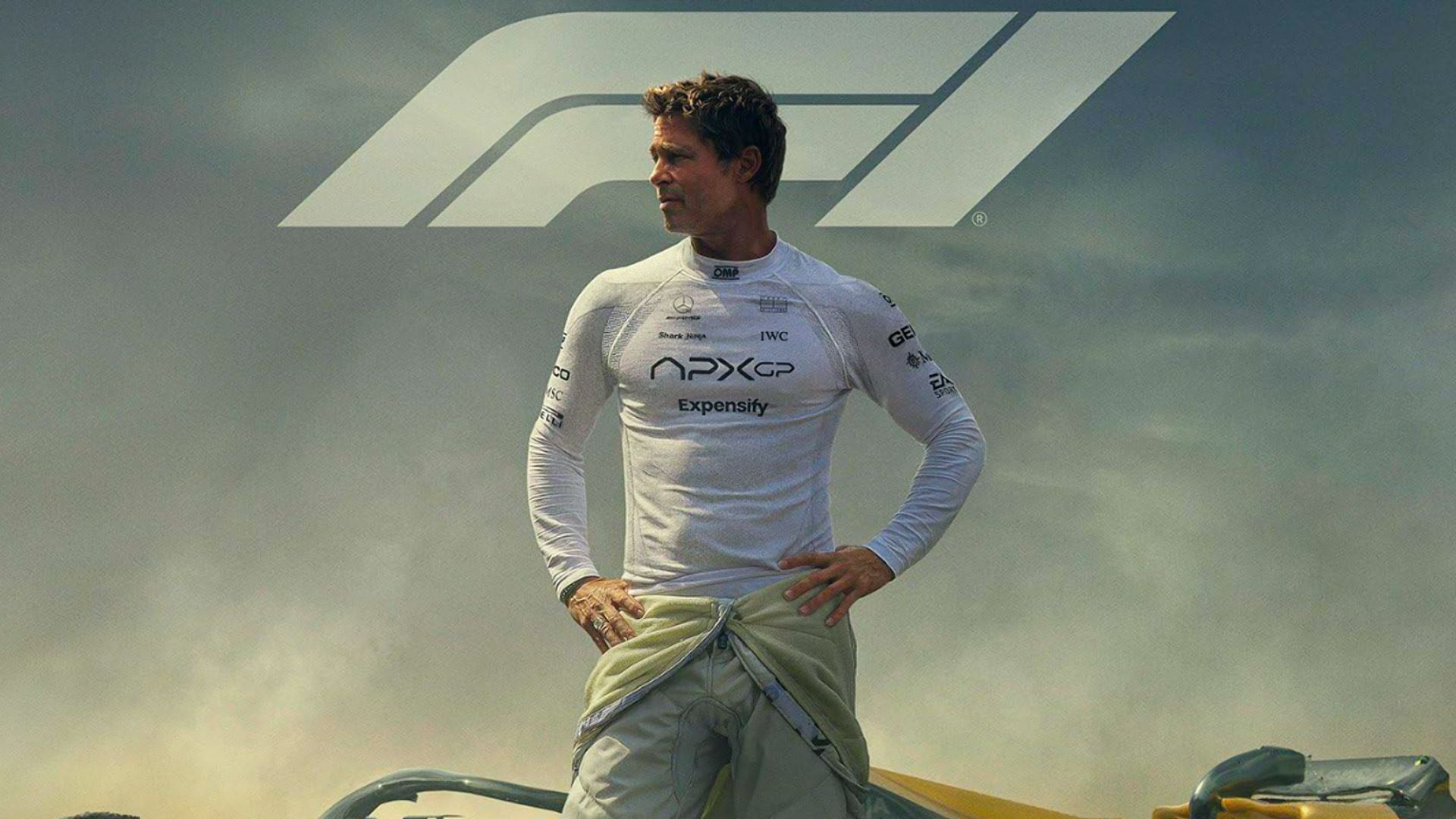 Actor Brad Pitt in racing suit looking to the side