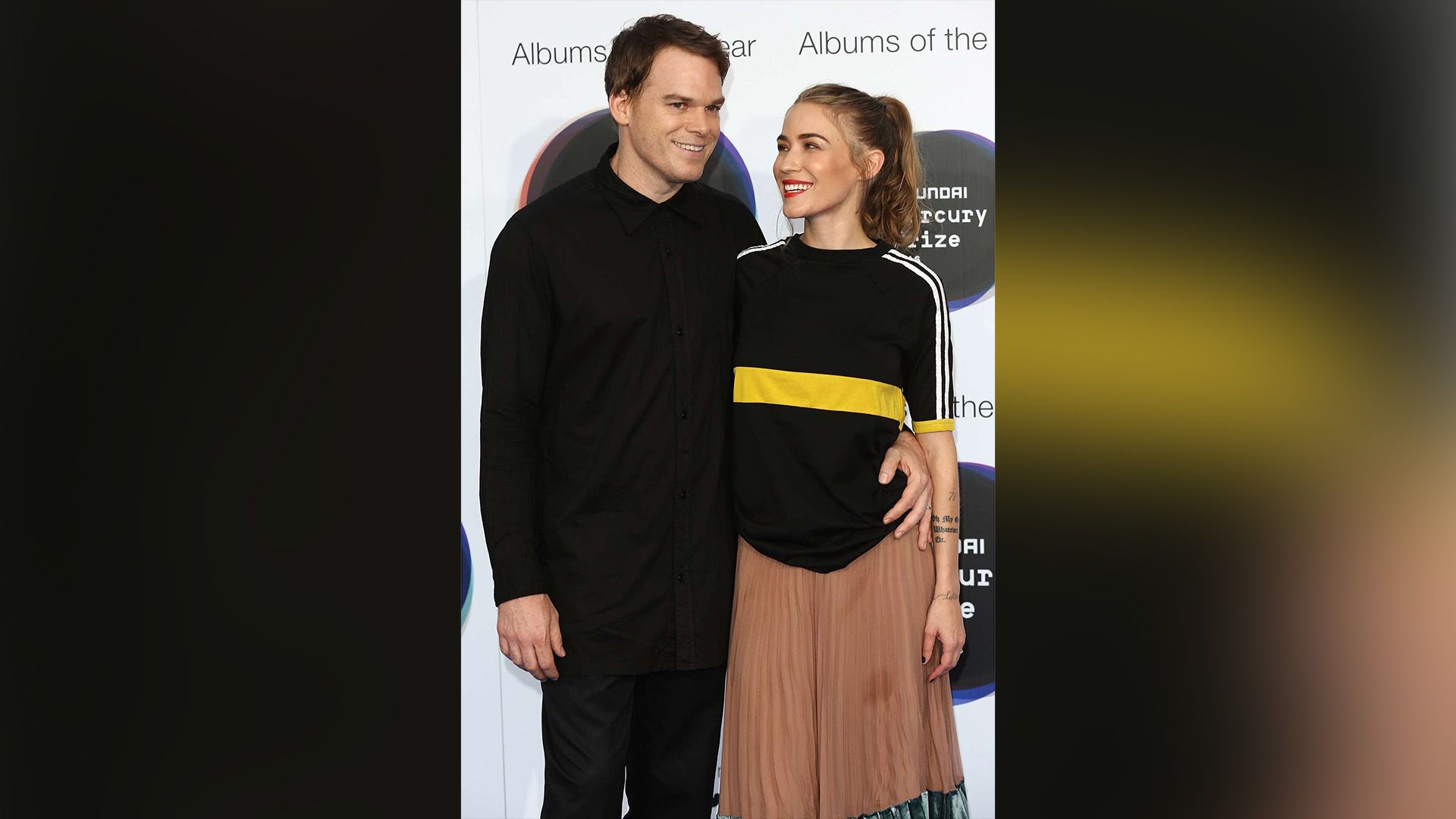 Michael C. Hall embraces smiling Morgan MacGregor