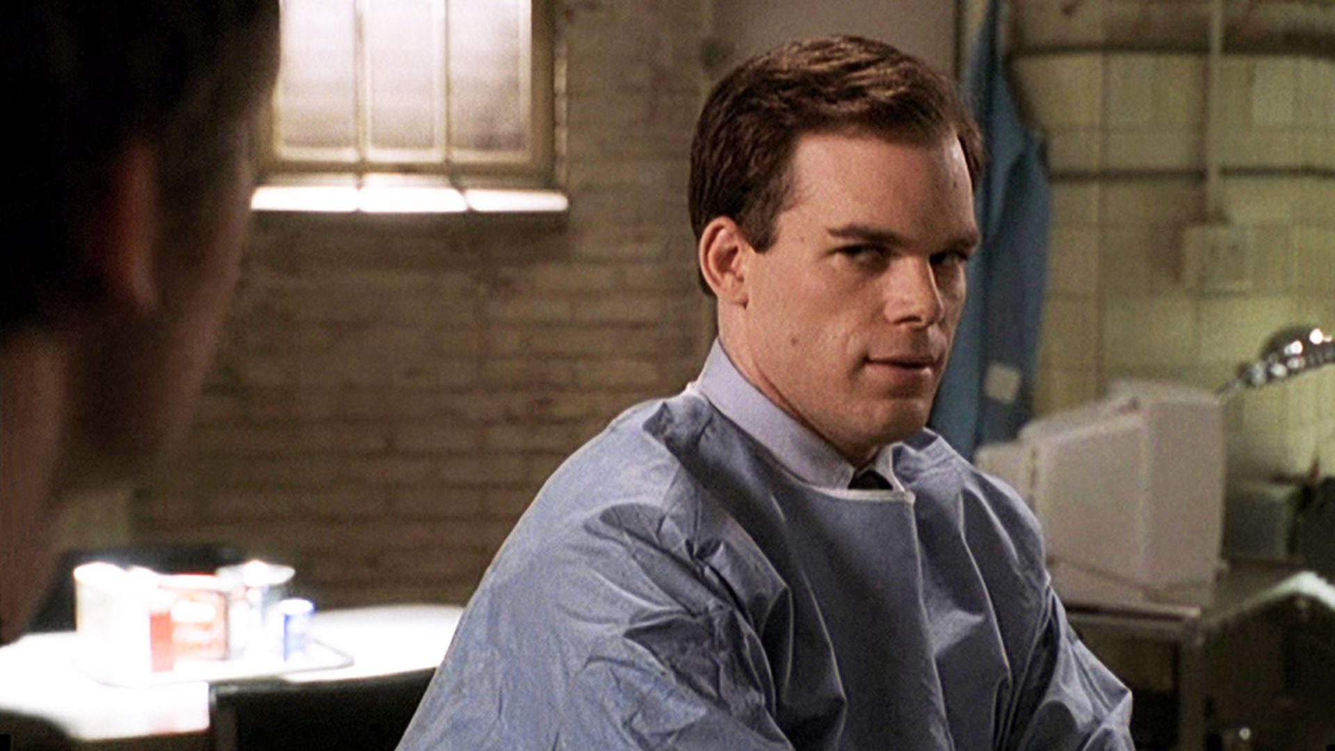Michael C. Hall in a blue medical gown