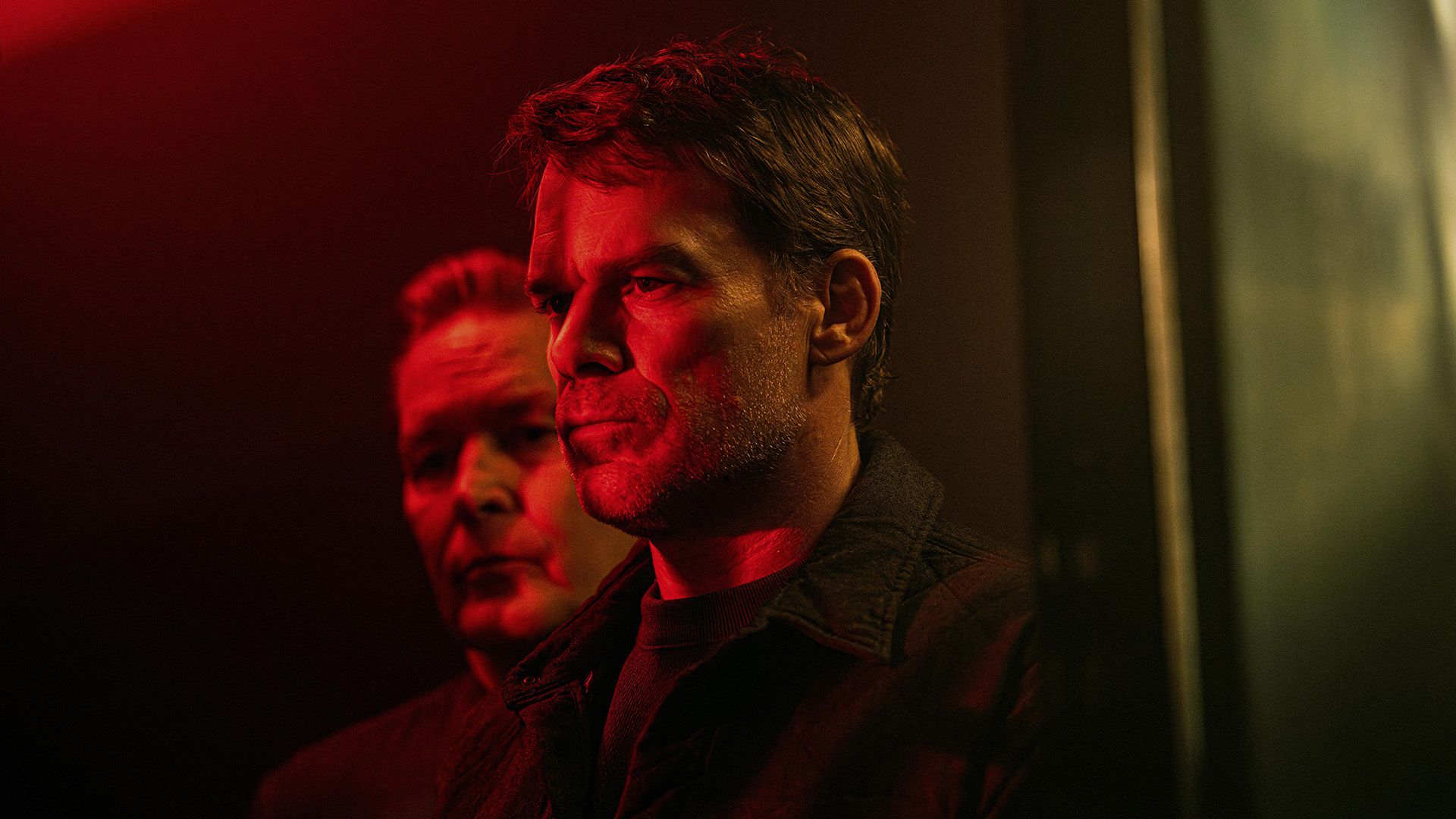 Michael C. Hall in dim lighting with red backlighting