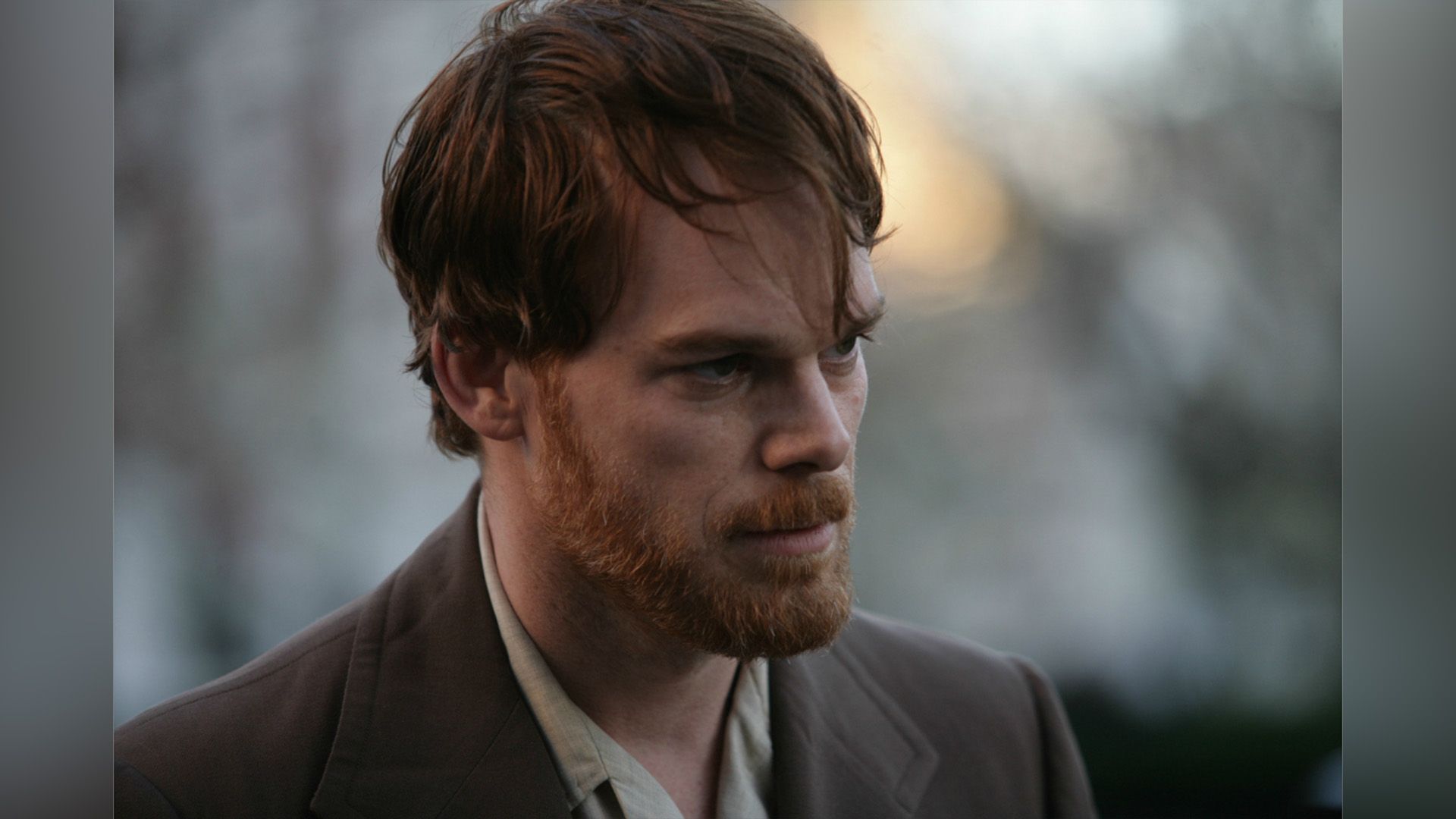 Michael C. Hall with mustache and beard in close-up