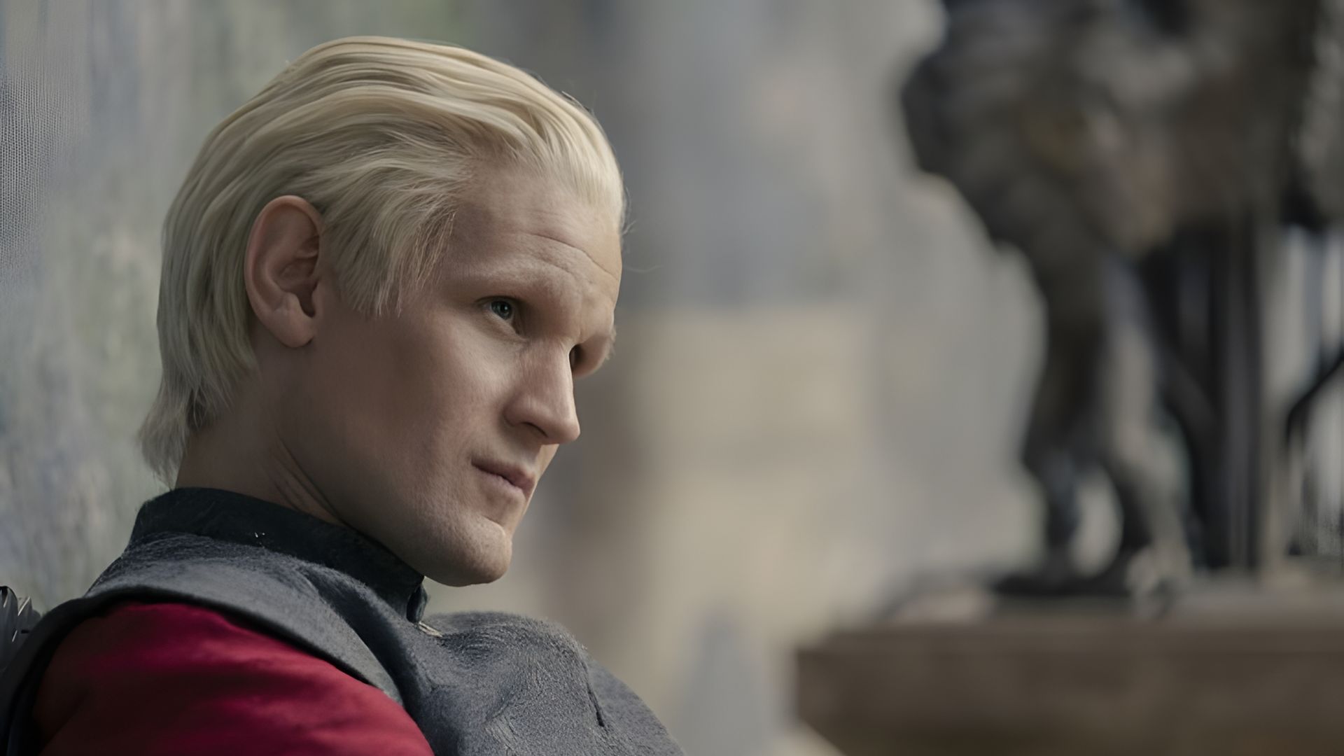 Matt Smith with blonde hair in profile, still from House of the Dragon