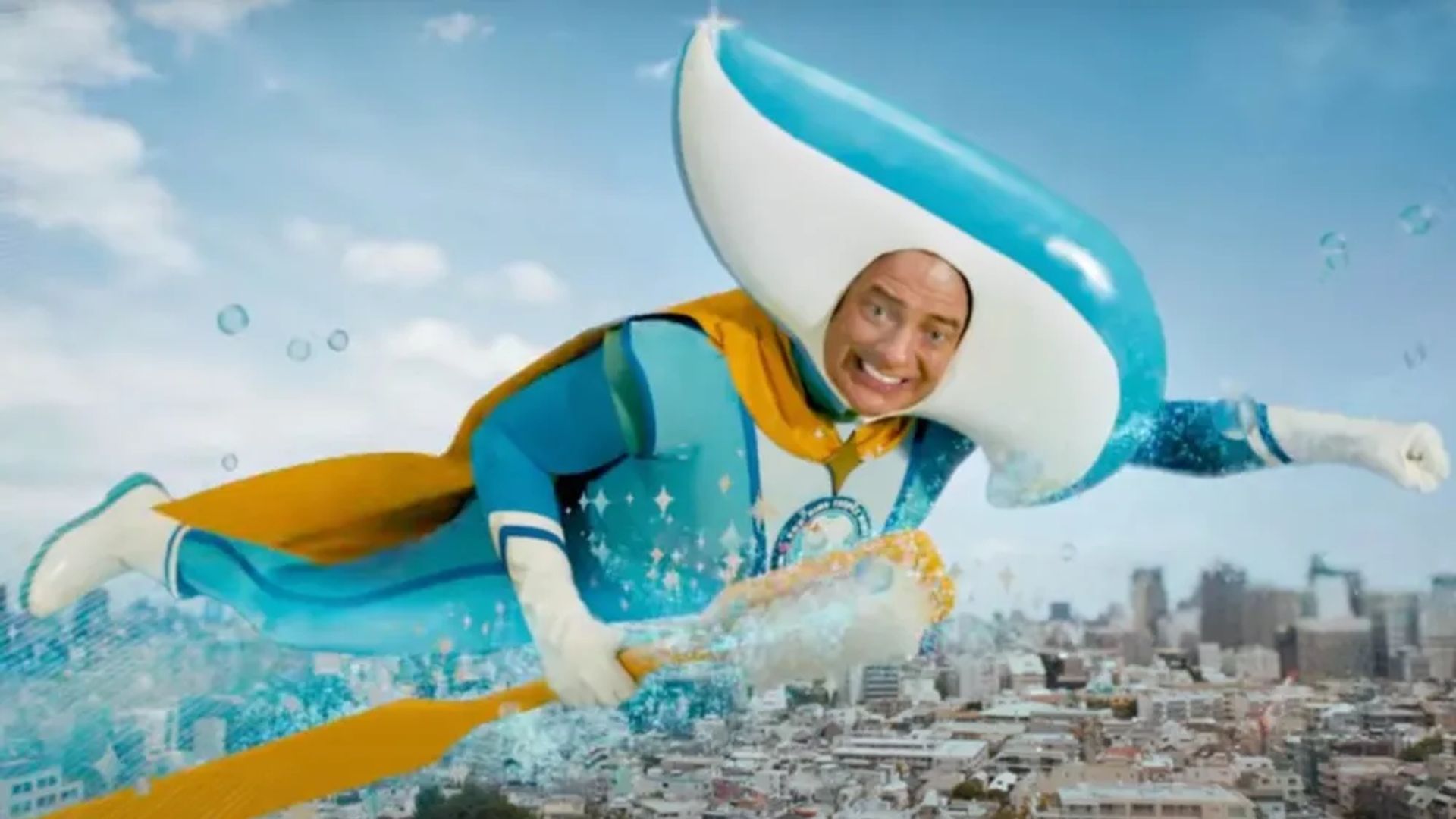 Brendan Fraser in a toothpaste tube costume flies through the sky