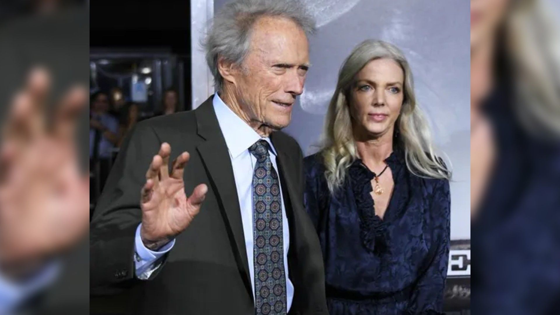 Clint Eastwood and Christina Sandera pose on the red carpet