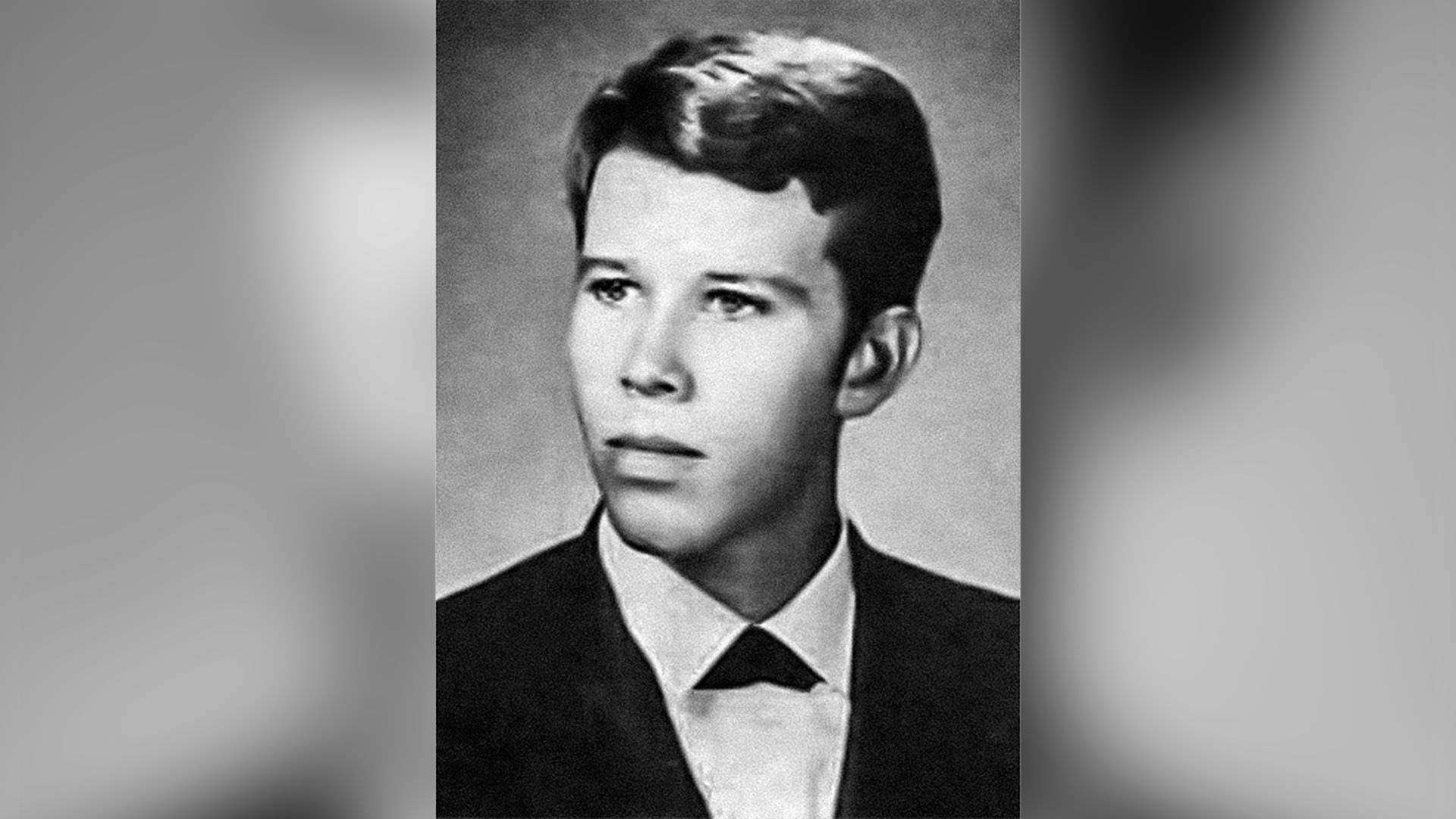 School portrait of Tom Waits in a jacket, three-quarter view