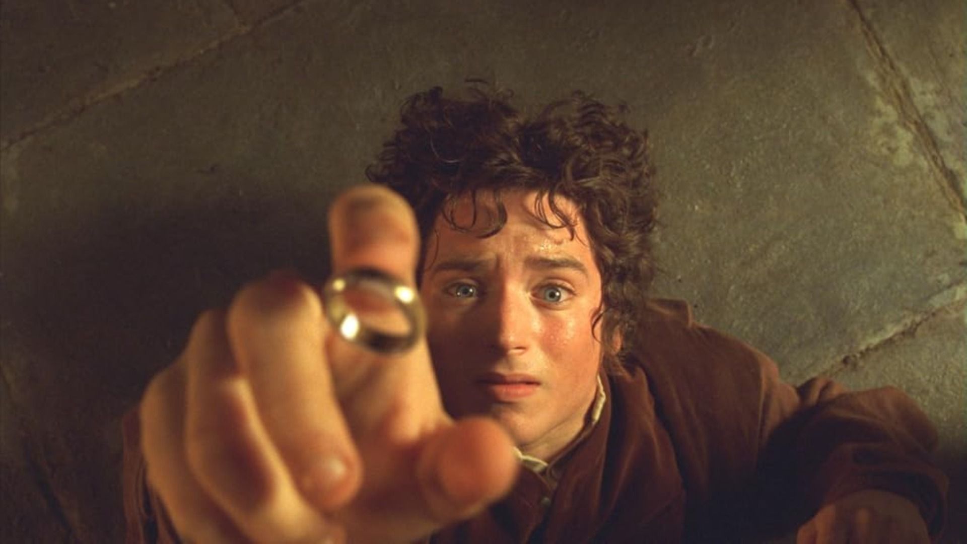 Actor Elijah Wood reaches for the golden ring in terror, falling to the floor