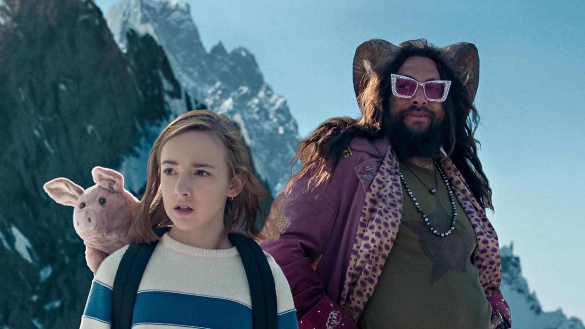 Marlowe Barkley and Jason Momoa against a backdrop of winter mountains