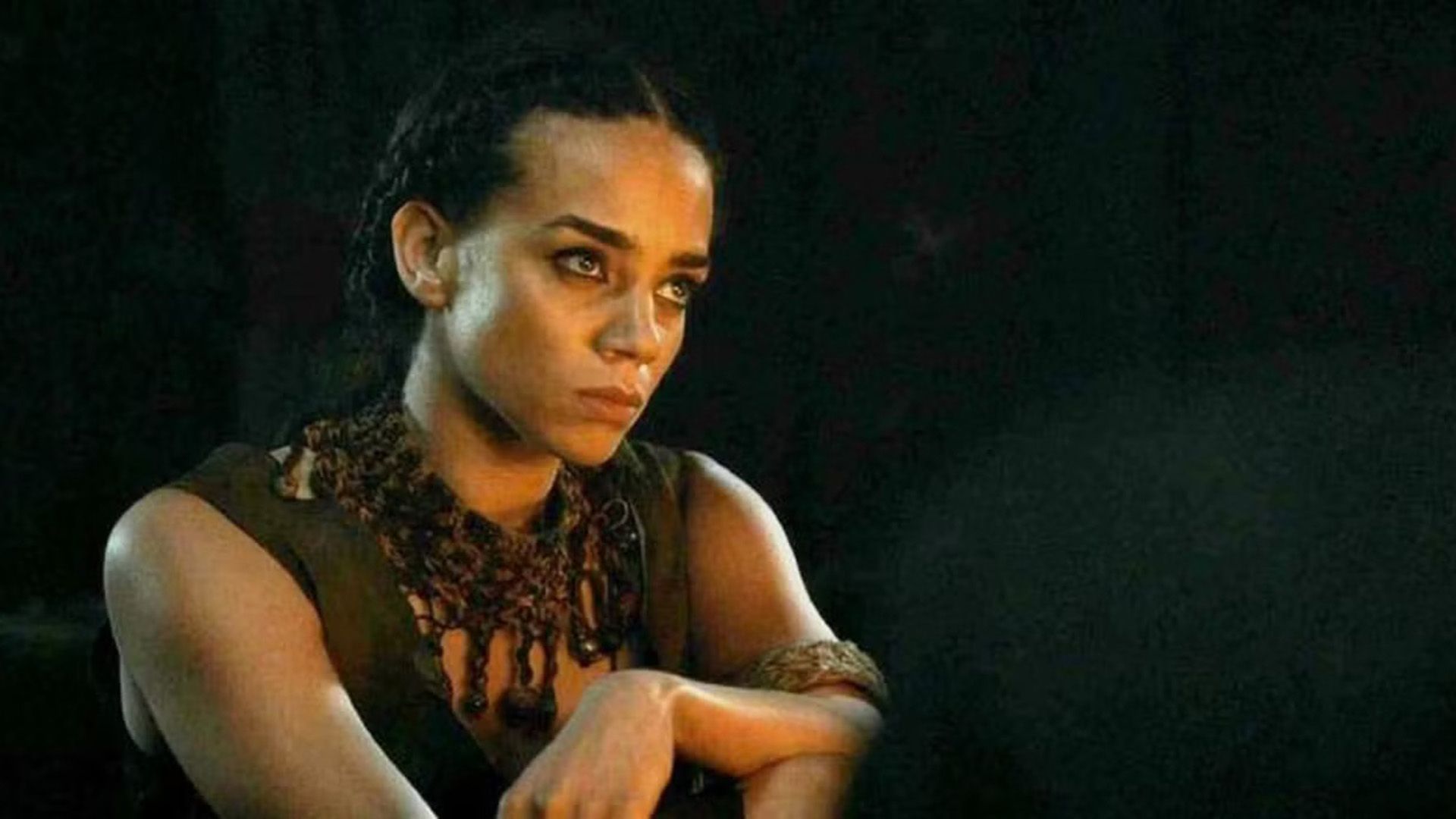 Hannah John-Kamen close-up in semi-darkness