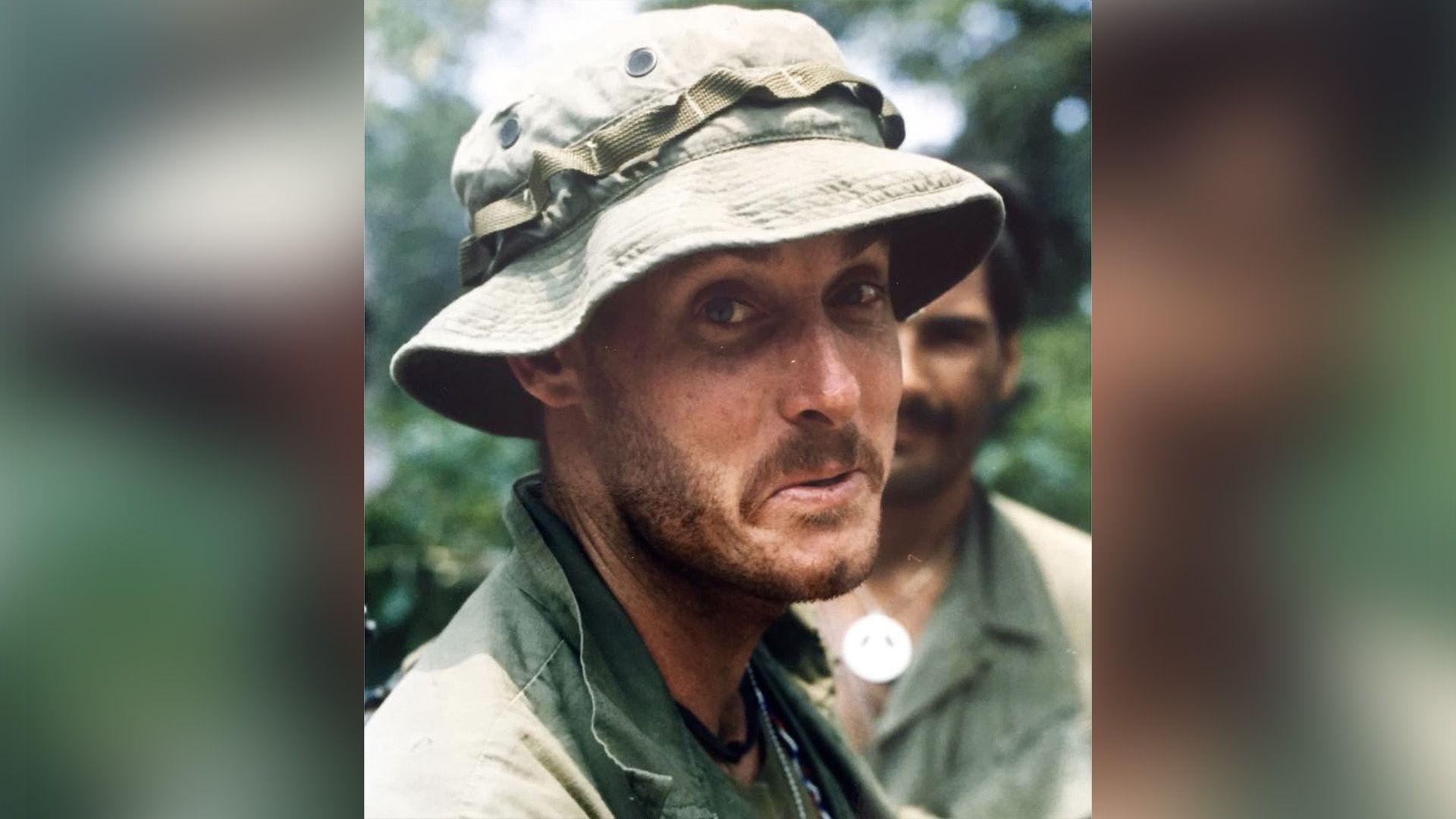 John C. McGinley in khaki jacket and panama hat