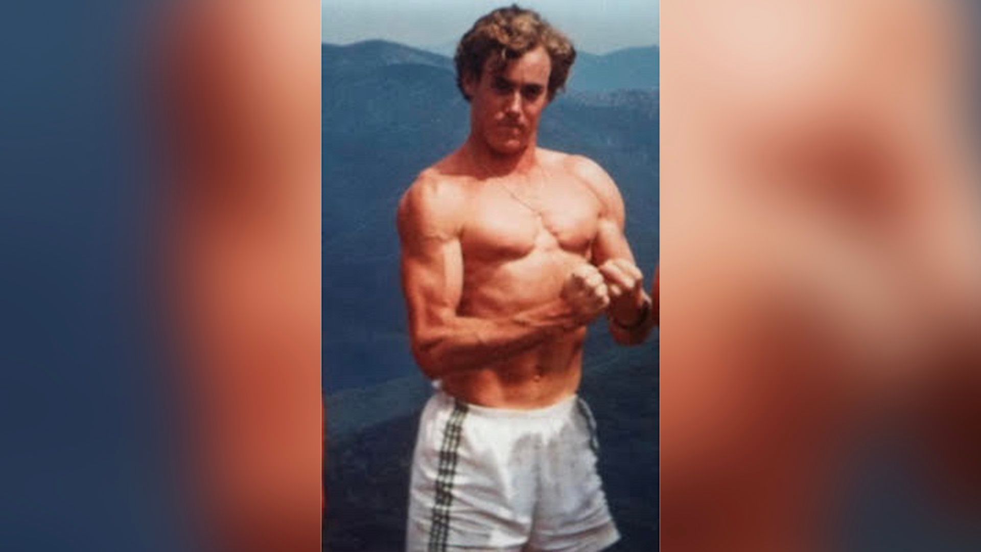 Young John C. McGinley in shorts showing off his muscles