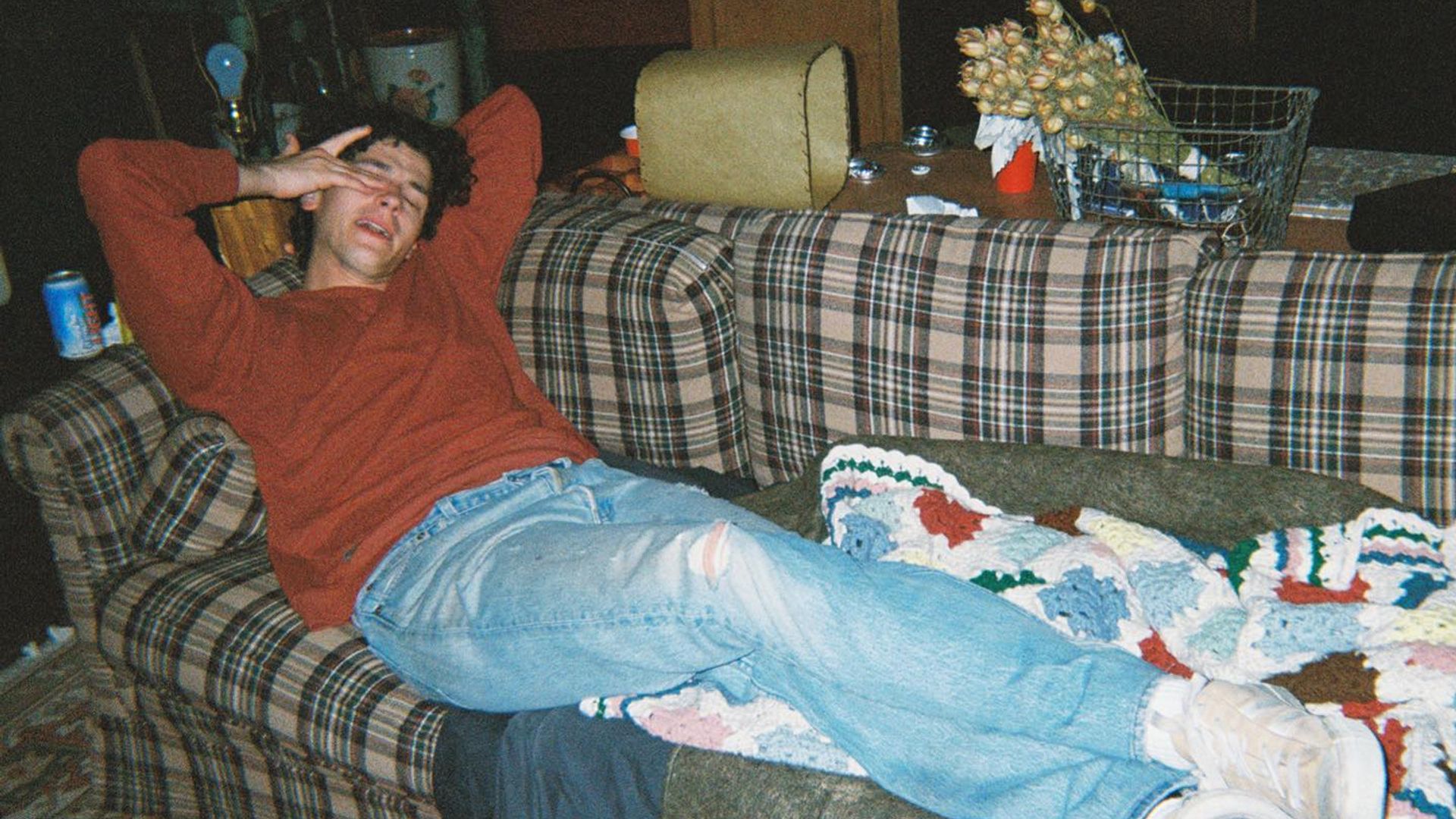 Owen Painter lounging on the couch in his home clothes