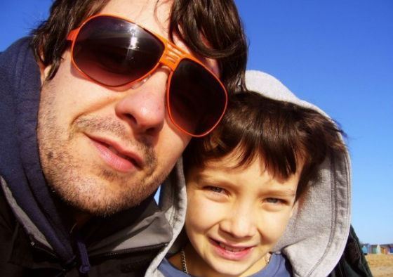 A very young Asa Butterfield and his father